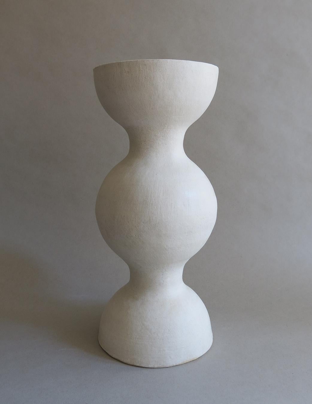 This exquisite sculptural ceramic stoneware BBL-7 Vessel by Humble Matter is hand-built out of an off-white textured stoneware with a smooth semi-matte glaze, which reflects a subtle hue that changes with the light. The piece measures 14.5