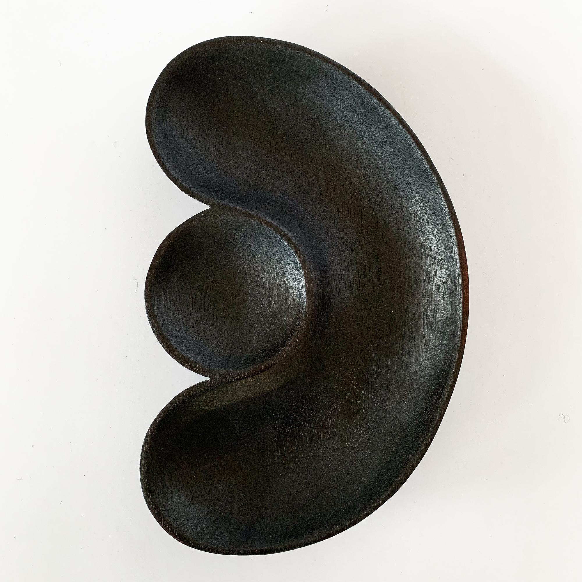 Large sculptural hand carved black ebonized mahogany bowl from the Native Tongue collection by Foxwood Co. Foxwood Co. is the work of Casey Reed Johnson, a designer and sculptor whose work is inspired by function and driven by form. His current work