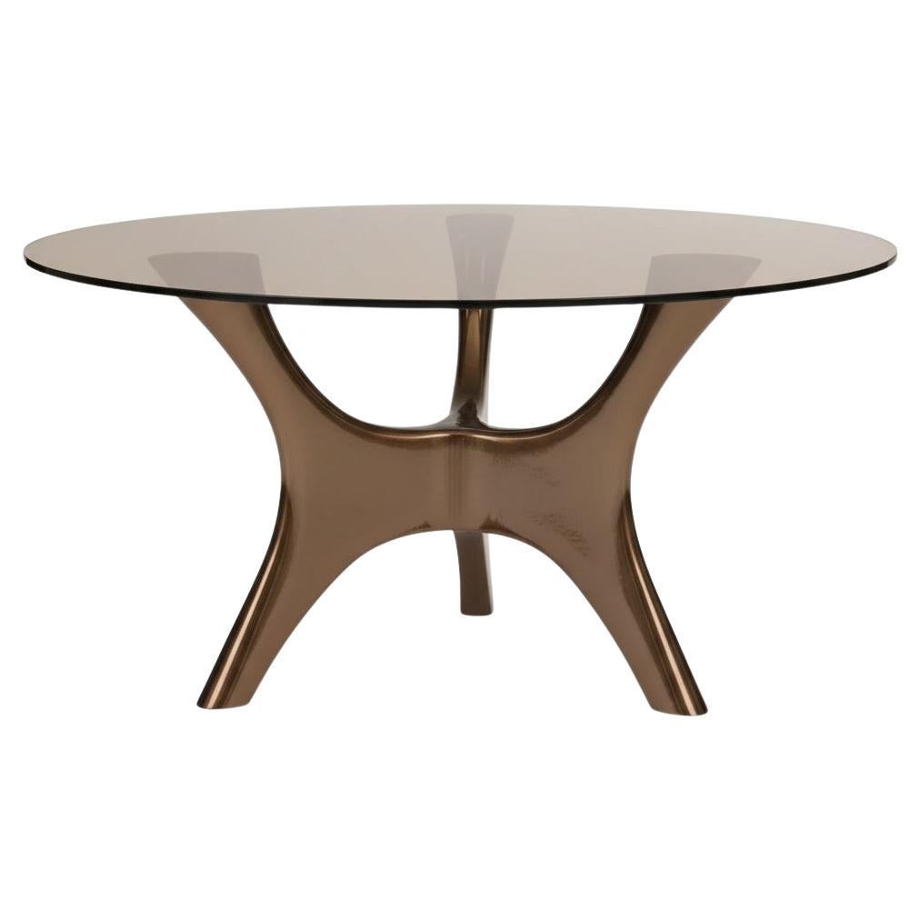 Tavolo da pranzo scultoreo da interno/esterno laccato in bronzo con piano in vetro