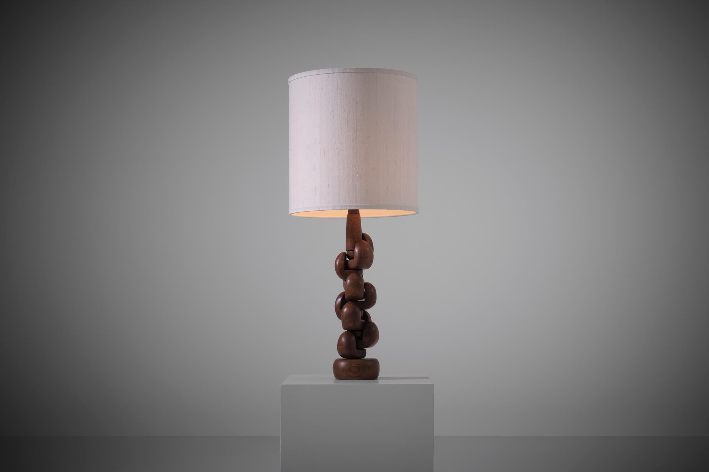 Sculptural Oak wooden Table Lamp, France 1960s. Intriguing sculptural design composed of several interlocking organic elbow shaped wooden parts. The parts are made from beautiful solid Oak with a nice exposed woodgrain, the parts can be moved around