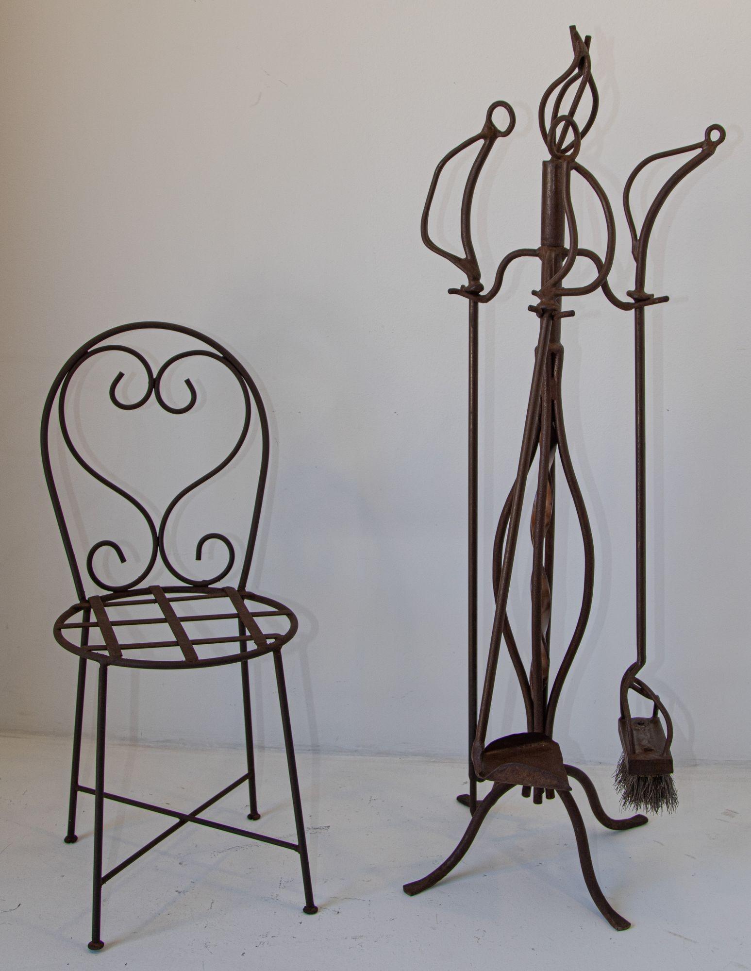 Iron Forged Oversized Fire Tools.
Forged fireplace tools, iron forged, artisan blacksmiths formed, forged stand with top scrolled four arms with poker, shovel and broom, missing tongs.
This sculptural hand-forged fireplace tool set is a true piece