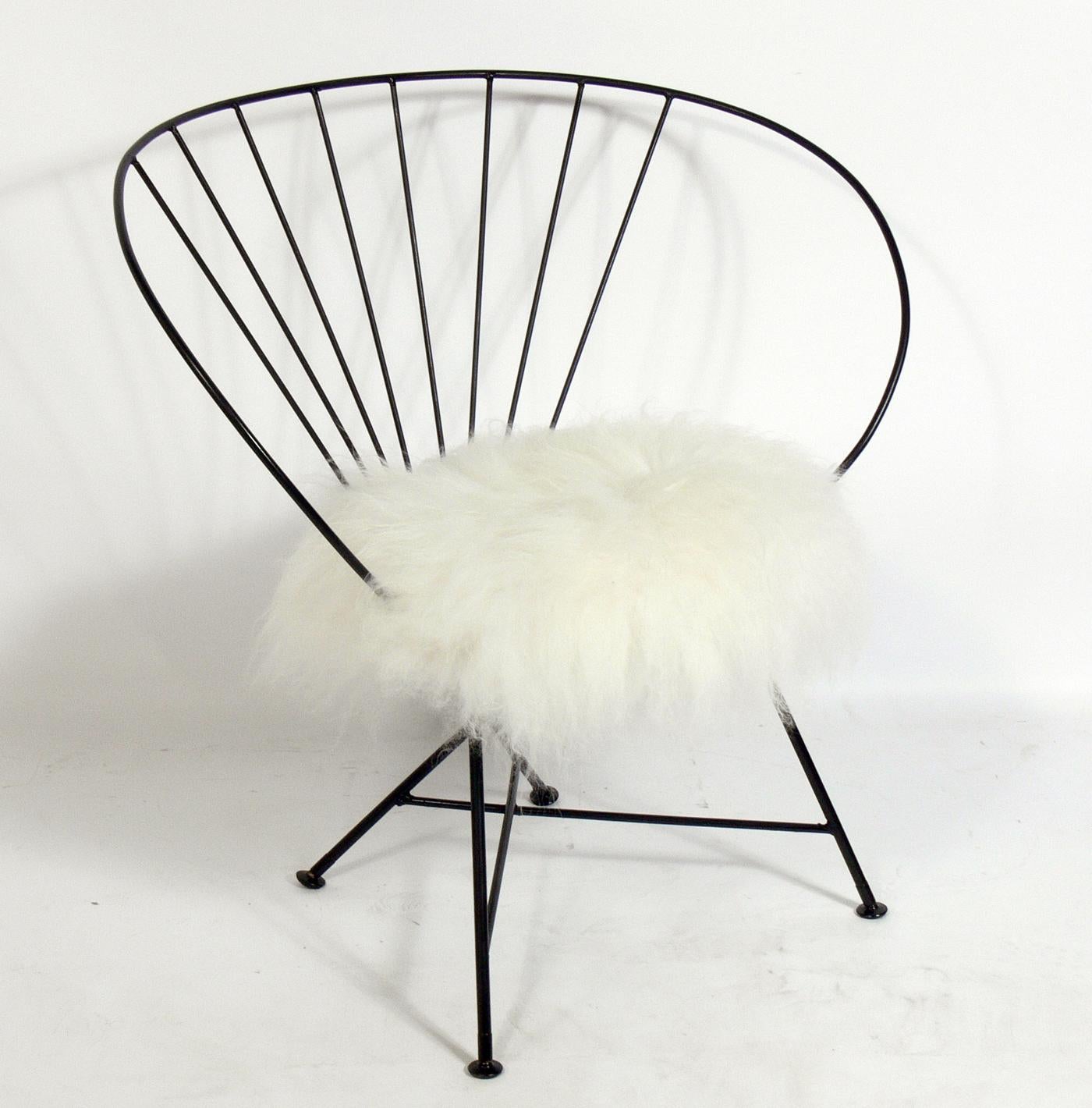 Sculptural iron lounge chair in Faux Fur, American, circa 1950s. It has been repainted and reupholstered in faux sheepskin. Sculptural form looks great from every angle!