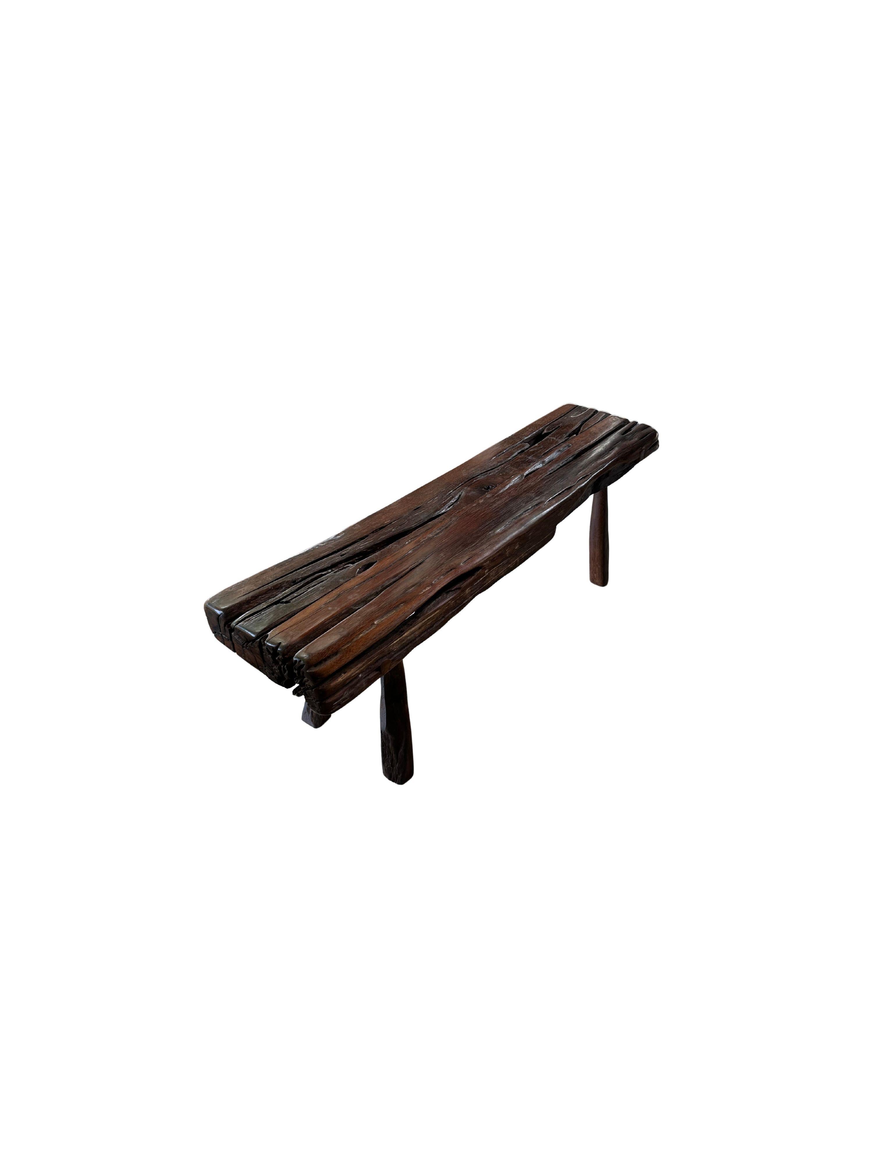 This modern organic bench is a striking blend of sustainability and craftsmanship, expertly crafted from reclaimed ironwood. The bench’s sleek, minimalist design showcases the raw beauty of the wood, with deep, intricate textures that speak to its