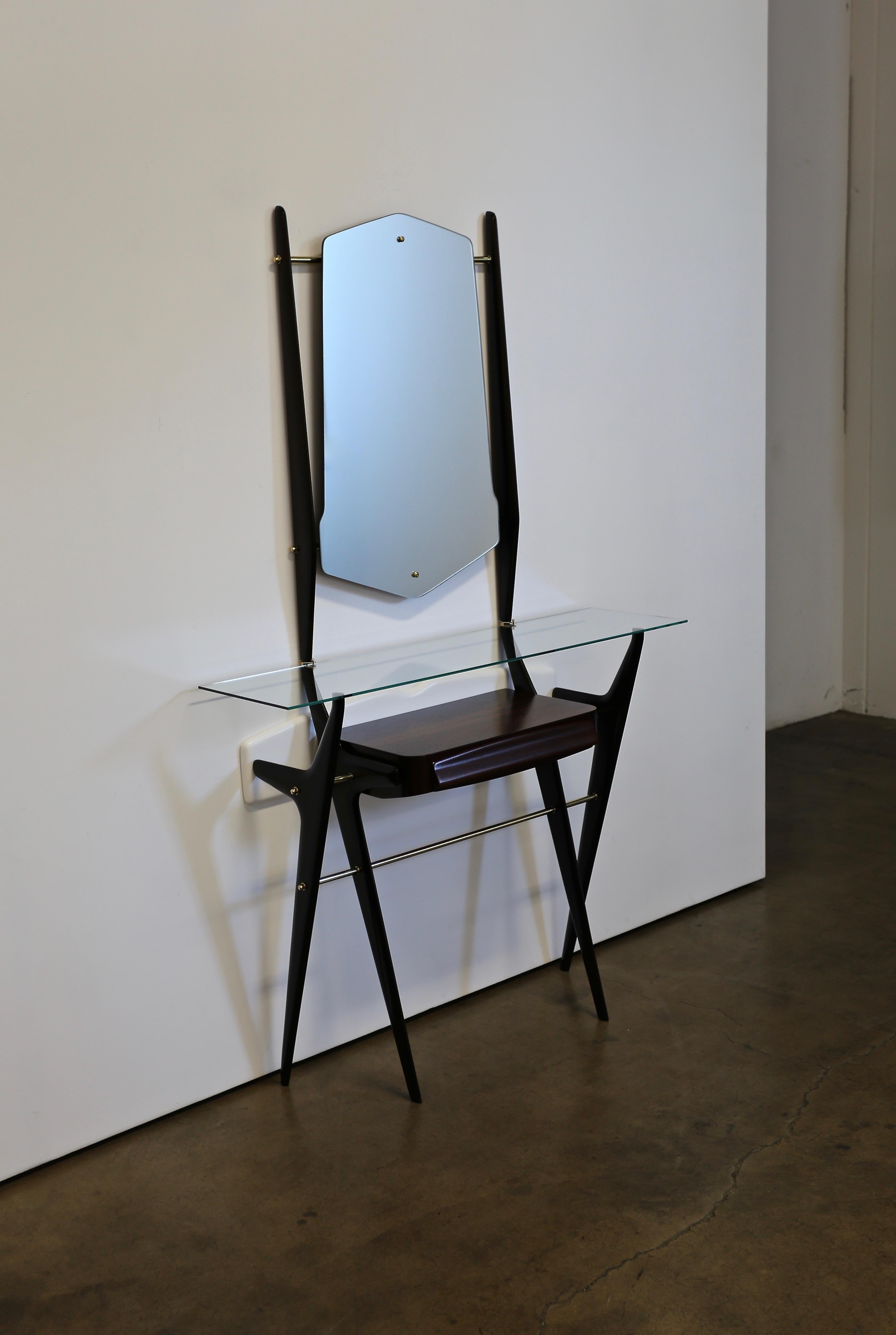 Sculptural Italian console with mirror, circa 1955. This piece has been professionally restored.