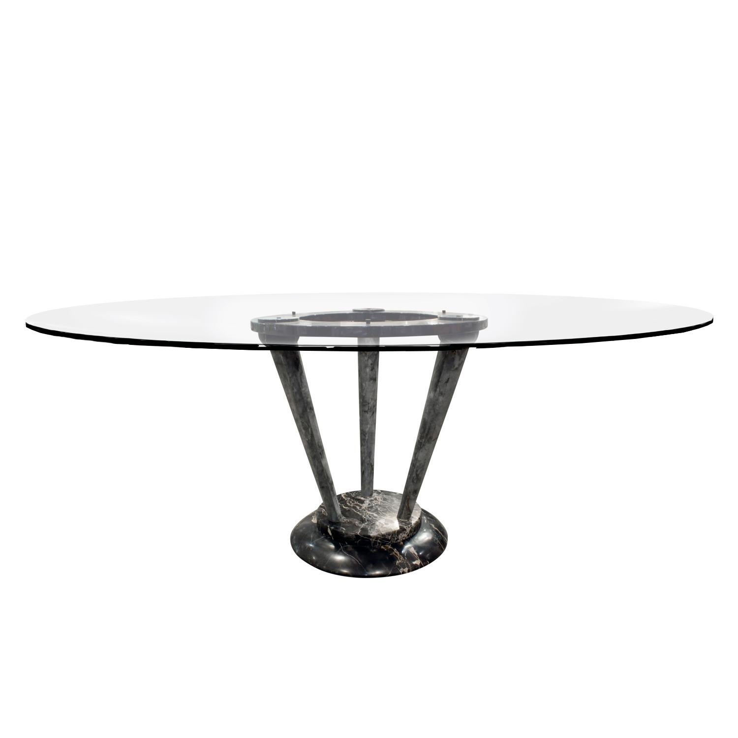 Sculptural pedestal dining table in figured black marble with round glass top, Italian, 1970s. This table would also work as an entry or hall table. It's a beautiful and elegant design.
