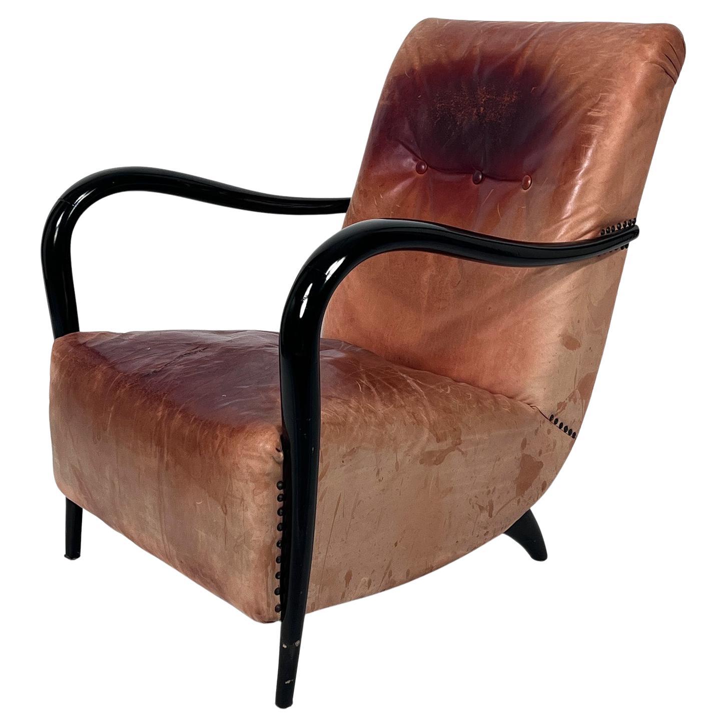 Poltrona scultorea italiana di metà secolo in pelle e Wood curvato degli anni 
50 in vendita