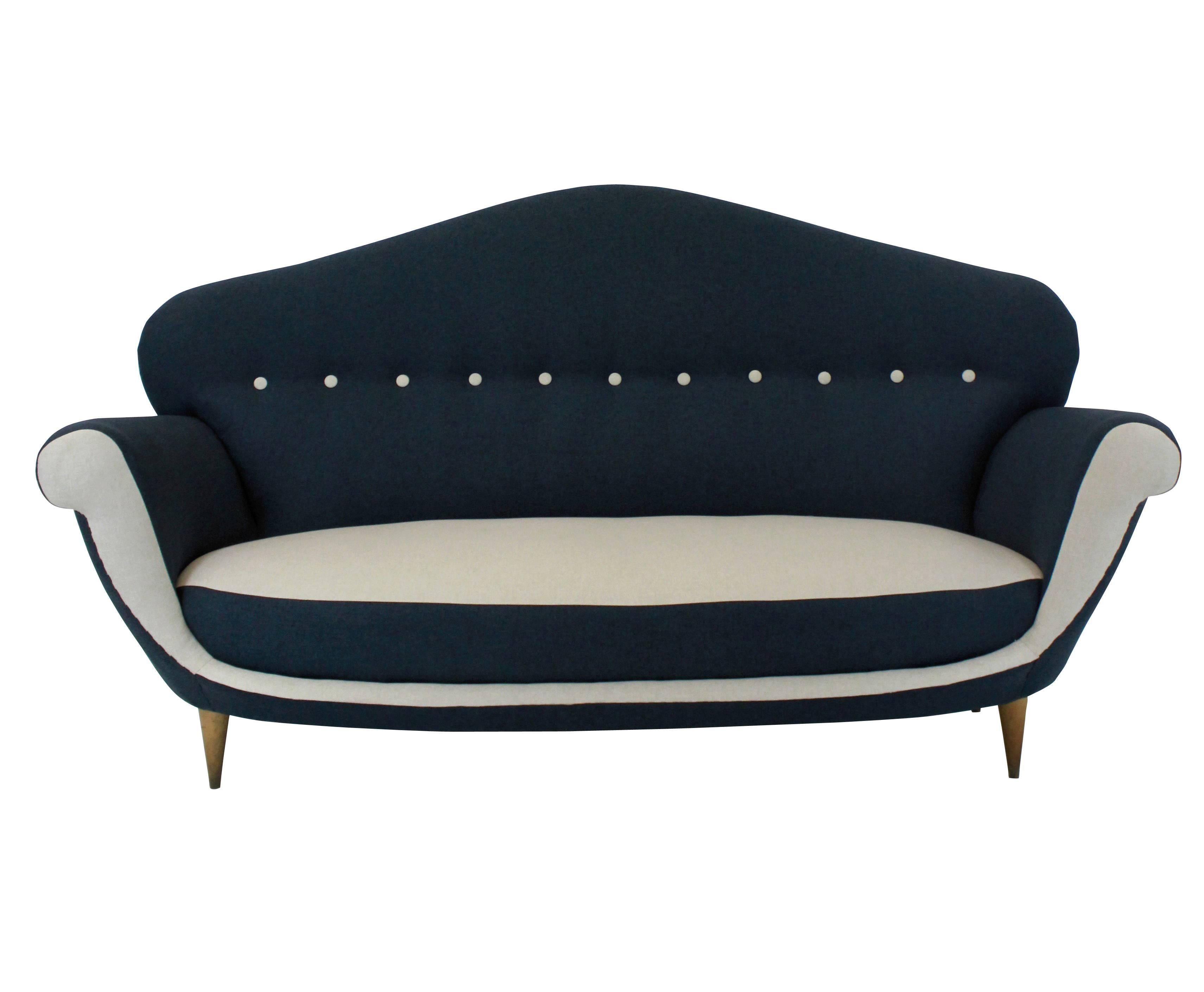 A large Italian sculptural settee of interesting design. Newly upholstered.