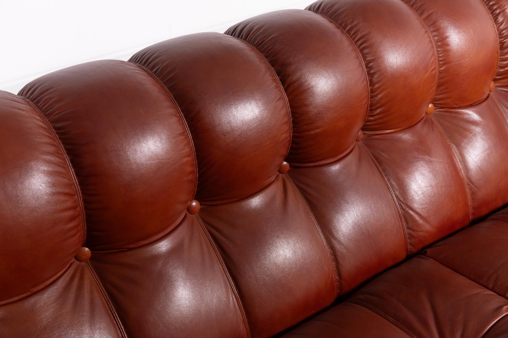 Mid-Century Modern Sculptural Italian Modern three seat cognac leather sofa, 1970’s For Sale
