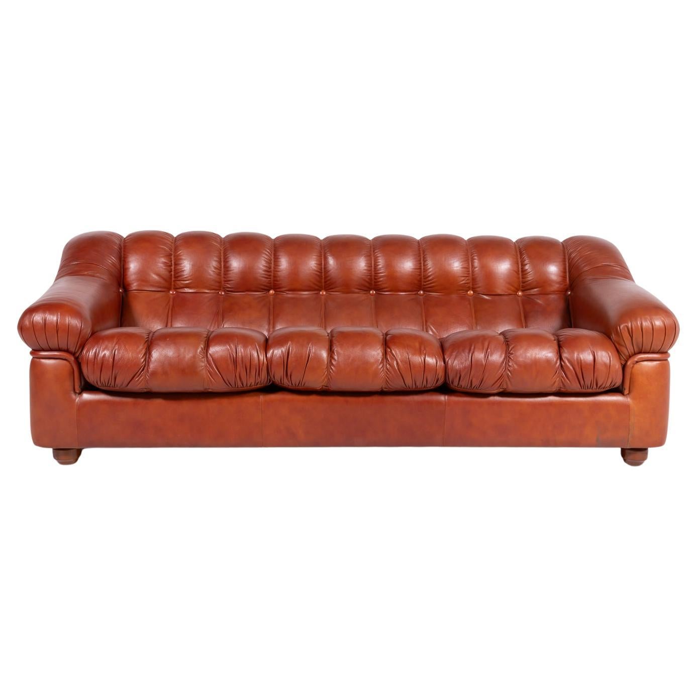 Sculptural Italian Modern three seat cognac leather sofa, 1970’s