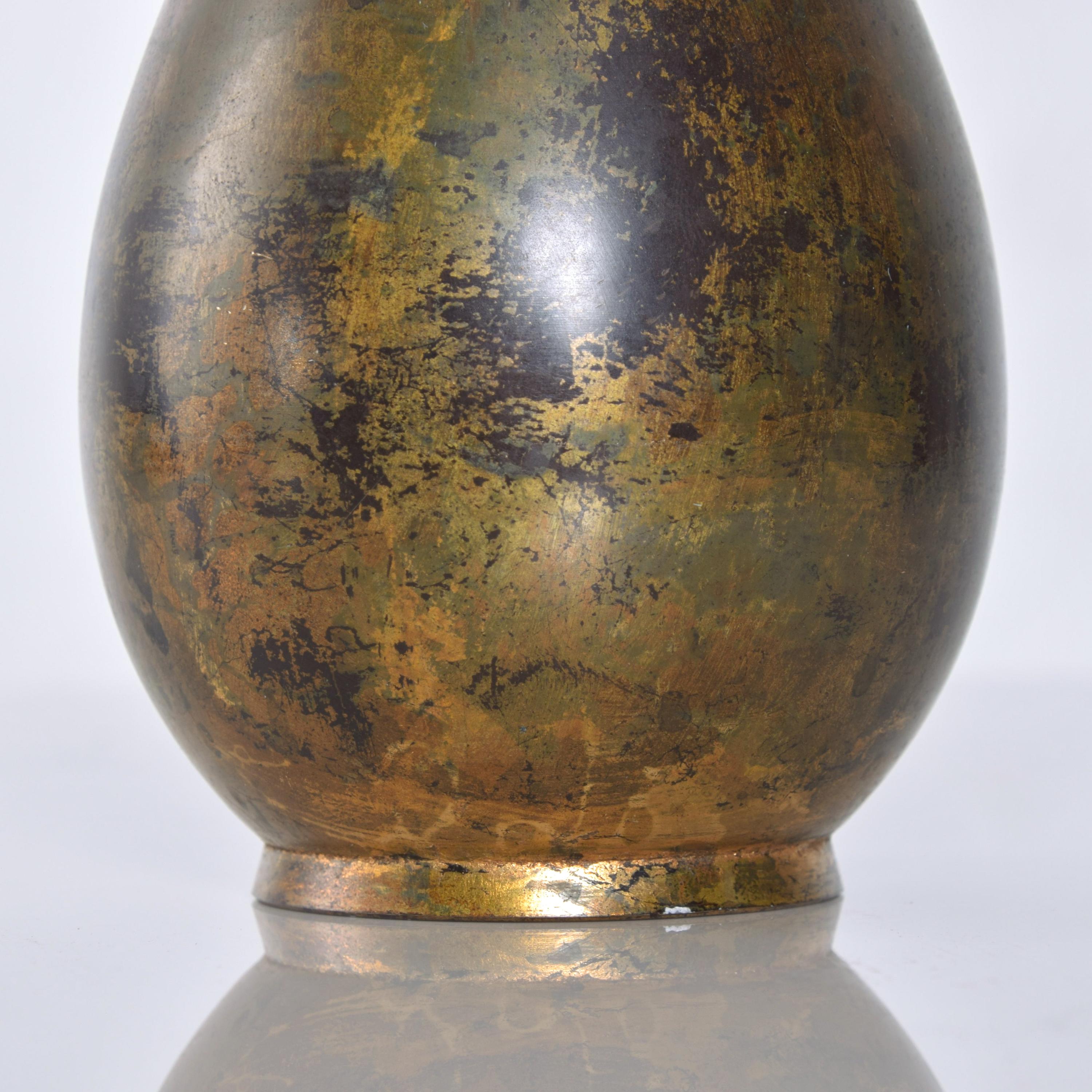 Sculptural Japanese mixed metal iron and gilt patinated ovoid vase flared narrow neck
Made in Japan, circa 1960
Measures: 9 height x 3.5 inches in diameter
Original vintage preowned condition. See images.