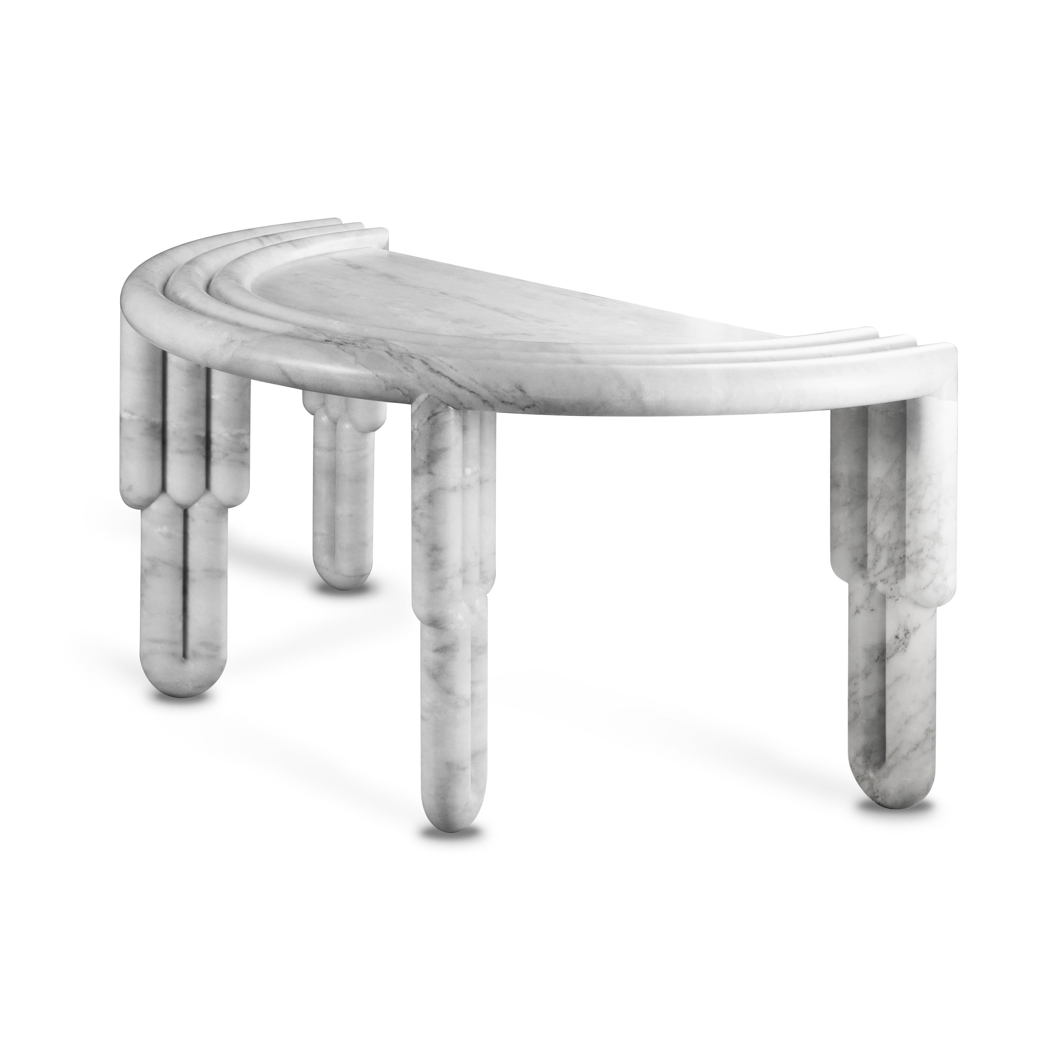 The Kipferl marble desk is made from rosa portugalo marble and has sculptural batons, reminiscent of sponge fingers, which support its top, a semi-circular crescent sug-gesting a sugar coated variety of the noble Austrian pastry.