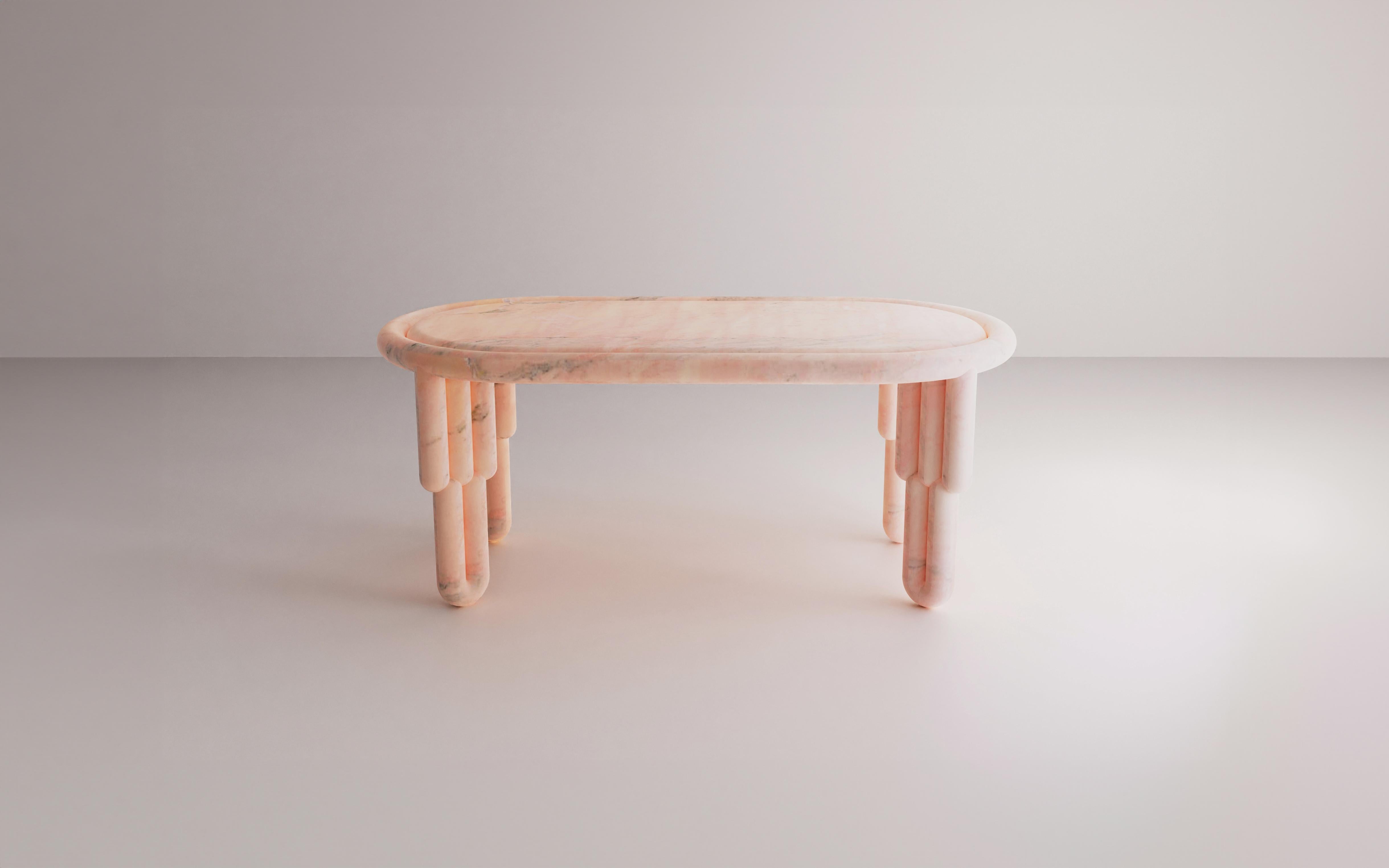 The Kipferl dining table features oblong top which is encased into circular round profile. It features sculptural legs of three batons which are supported at the bottom with curved ending of two batons. The table comes in 180 cm and 220 cm lengths,