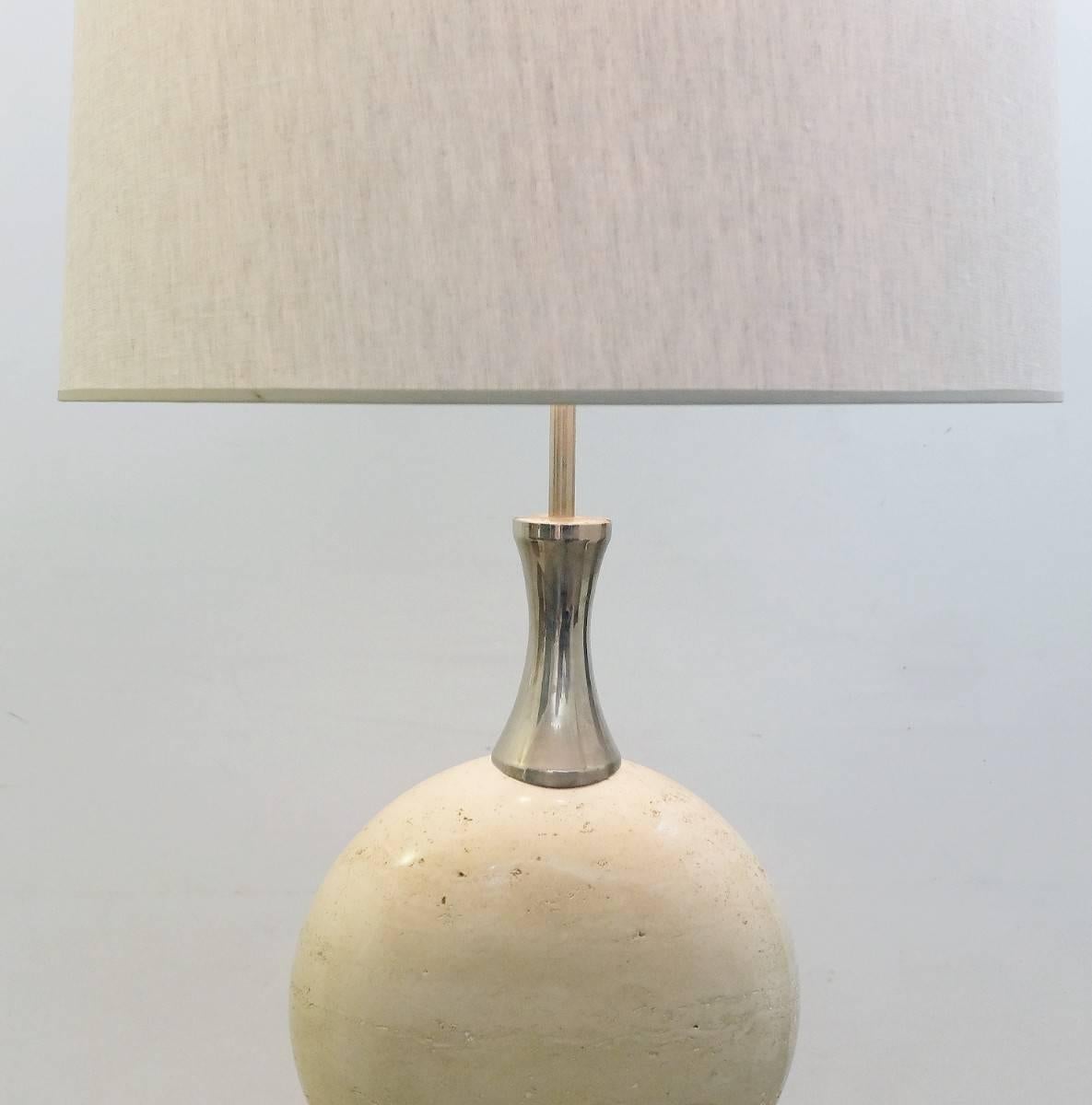 Large lamp in travertine and metal by Philippe Barbier for Maison Barbier in the 1970s. It's one big piece, the lamp is fixed to a pedestal in travertine.
The diameter of the shade is 57 cm and height 49 cm. The measures are not included the