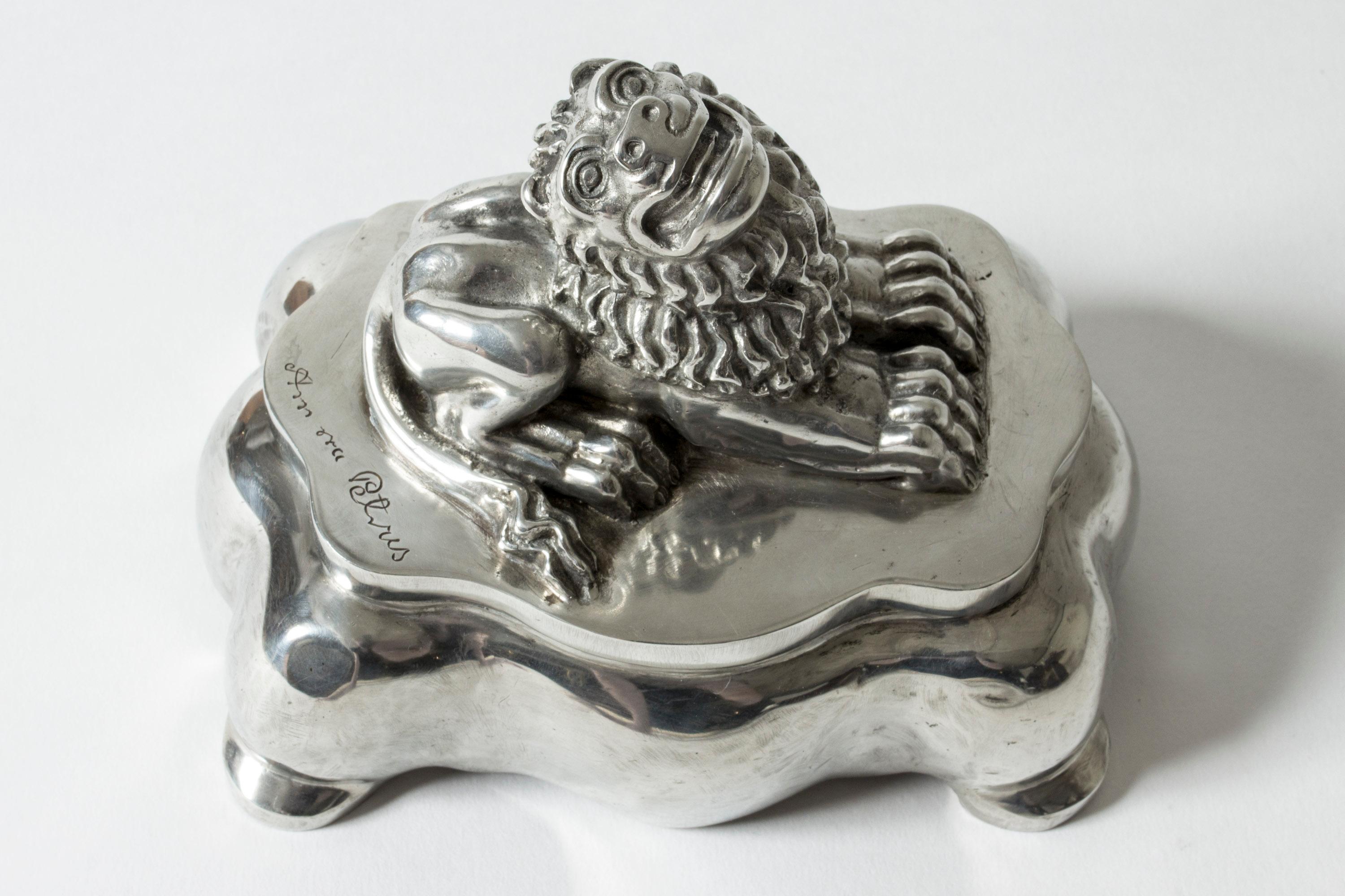 Pewter inkwell by Anna Petrus, designed in the period 1925-1927, when Petrus worked for Herman Bergman. Adorned with the expressive lion that is one of Petrus’ signature designs. Loose glass insets in the indentures made for ink.

Anna Petrus was