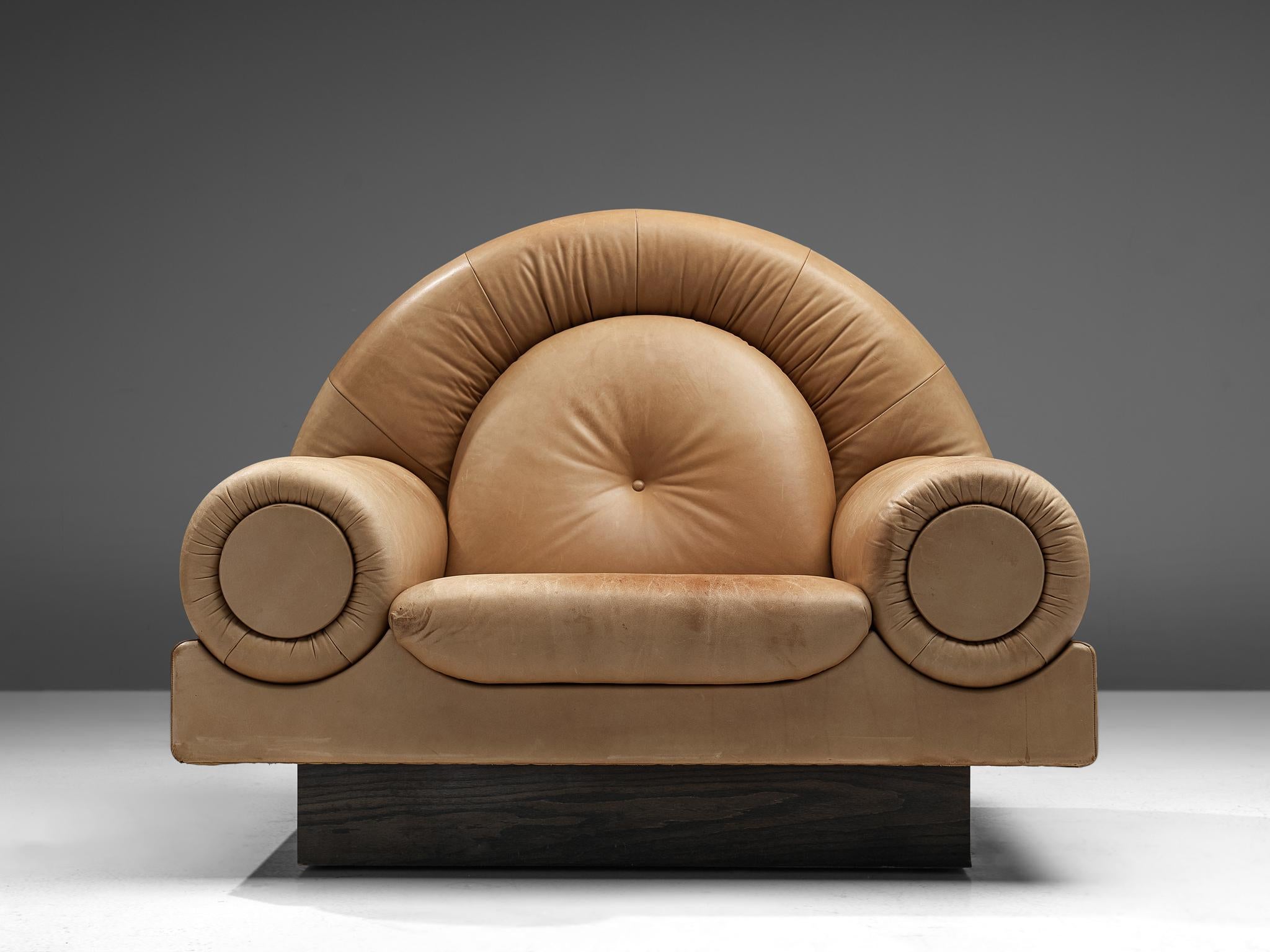 Easy chair, wood, leather, Europe, 1980s 

This lounge chair bears stylistic traits of various art periods and can therefore be seen as an eclectic design. A triumphal arch shape is discernible in the back and armrests, sculpted in a classical way