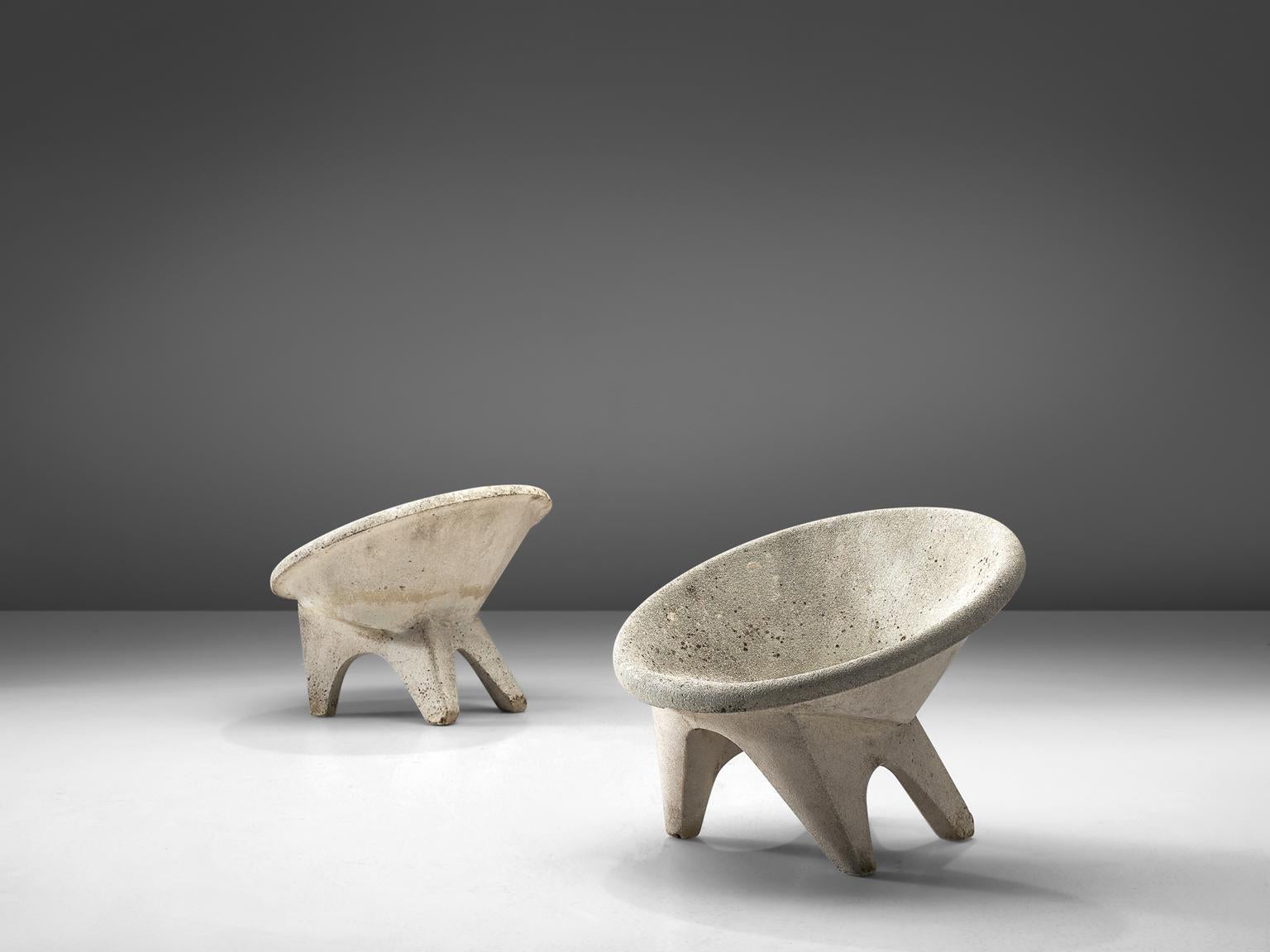 Set of 2 outdoor chairs, concrete, Europe, 1970s.

These characteristic lounge chairs are completely made of concrete, which make them perfect for outdoor use. The chairs feature a round shell that function as the seat. The bulky legs are slightly