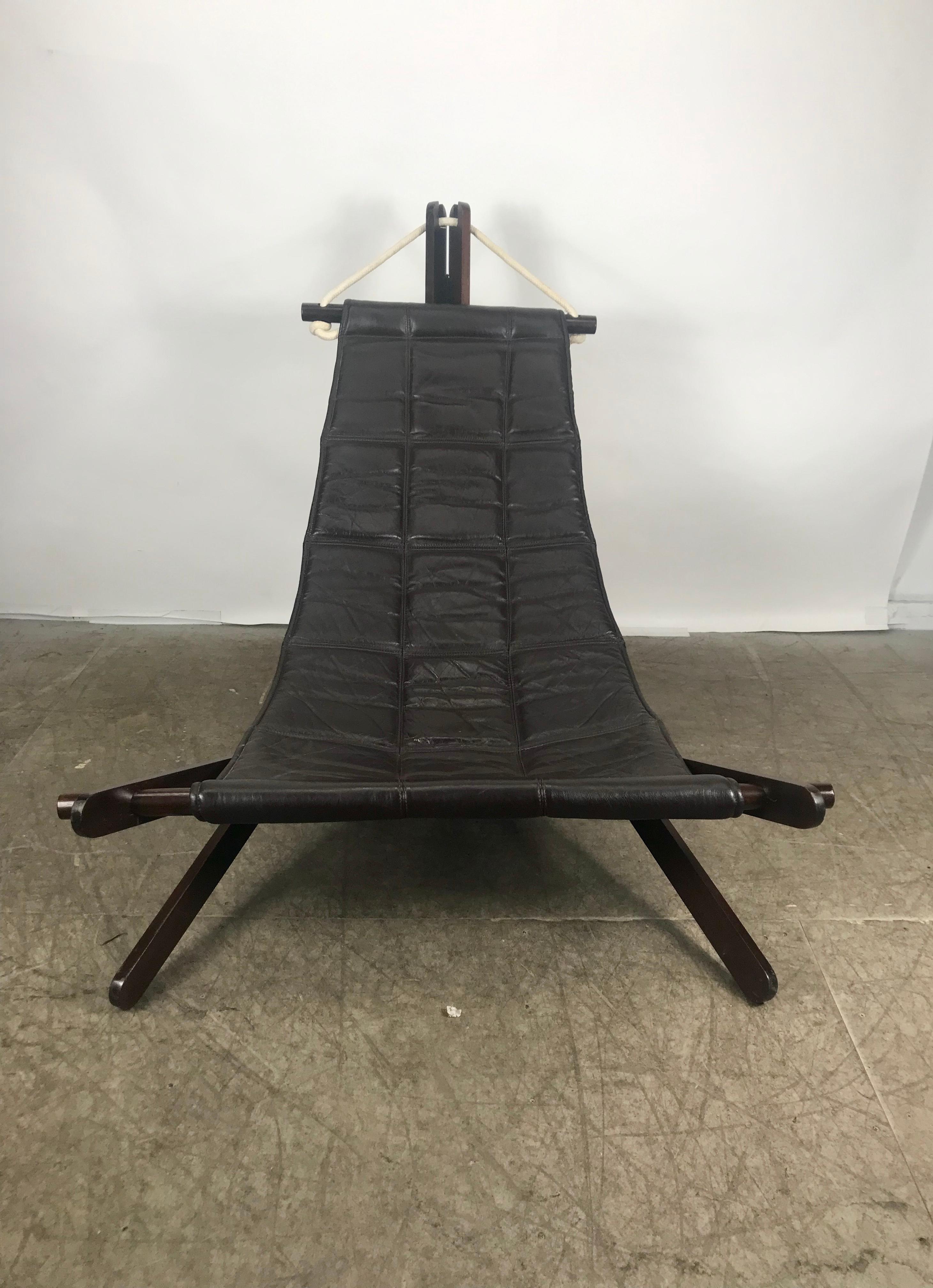 Rare and collectible sling chair in Cherry (Jatoba) wood, rich brown leather and rope by British architect Dominic Michaelis for Moveis Corazza, Brazil. Hand delivery avail to New York City or anywhere en route from Buffalo, NY.
