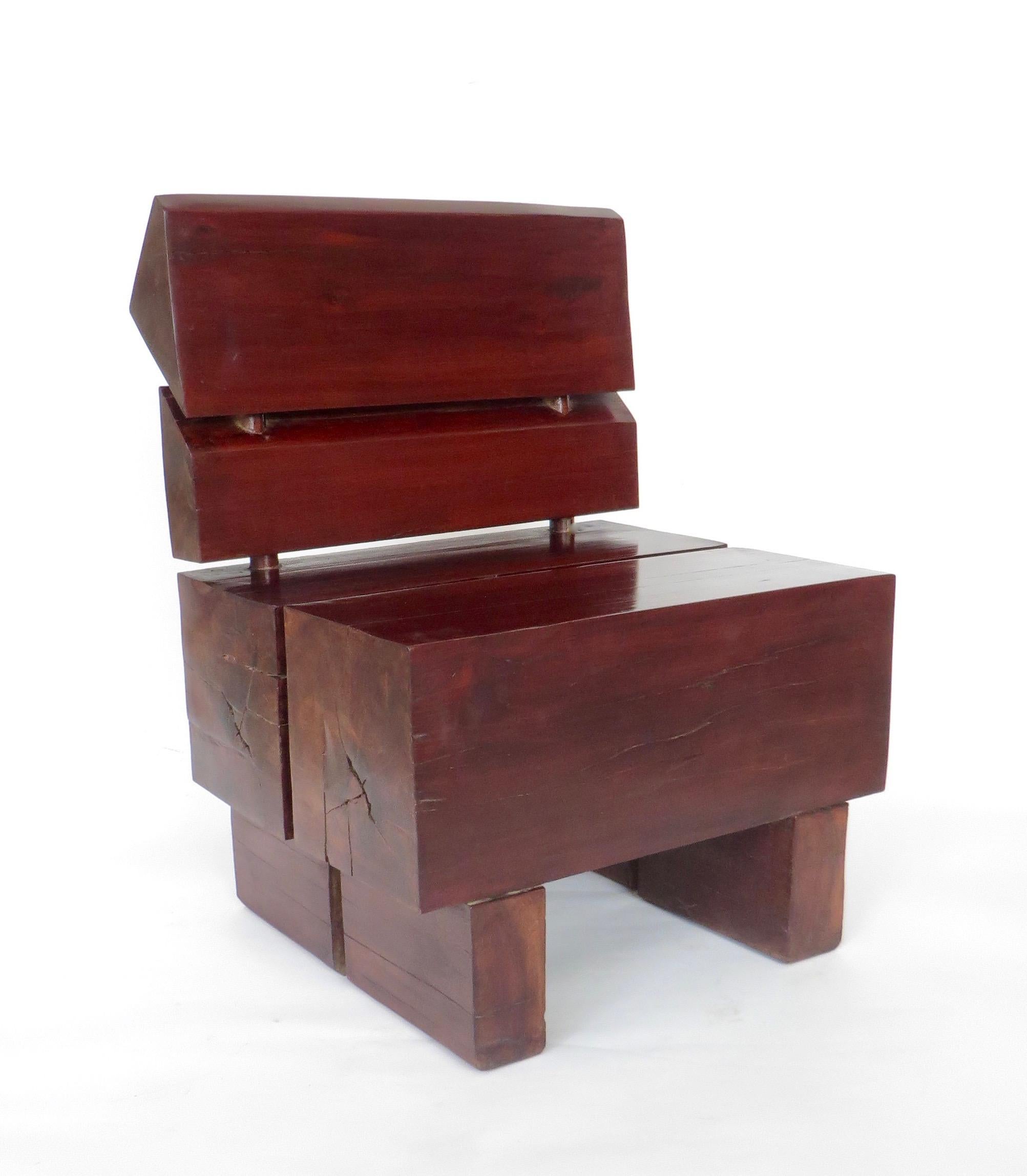 This Brazilian rosewood organic modernist low chair in the style of Jose Zanine de Caldas presents as much as a sculpture as a chair.
It is heavy and organic constructed from large monumental pieces of wood.
The seat being two massive sections of