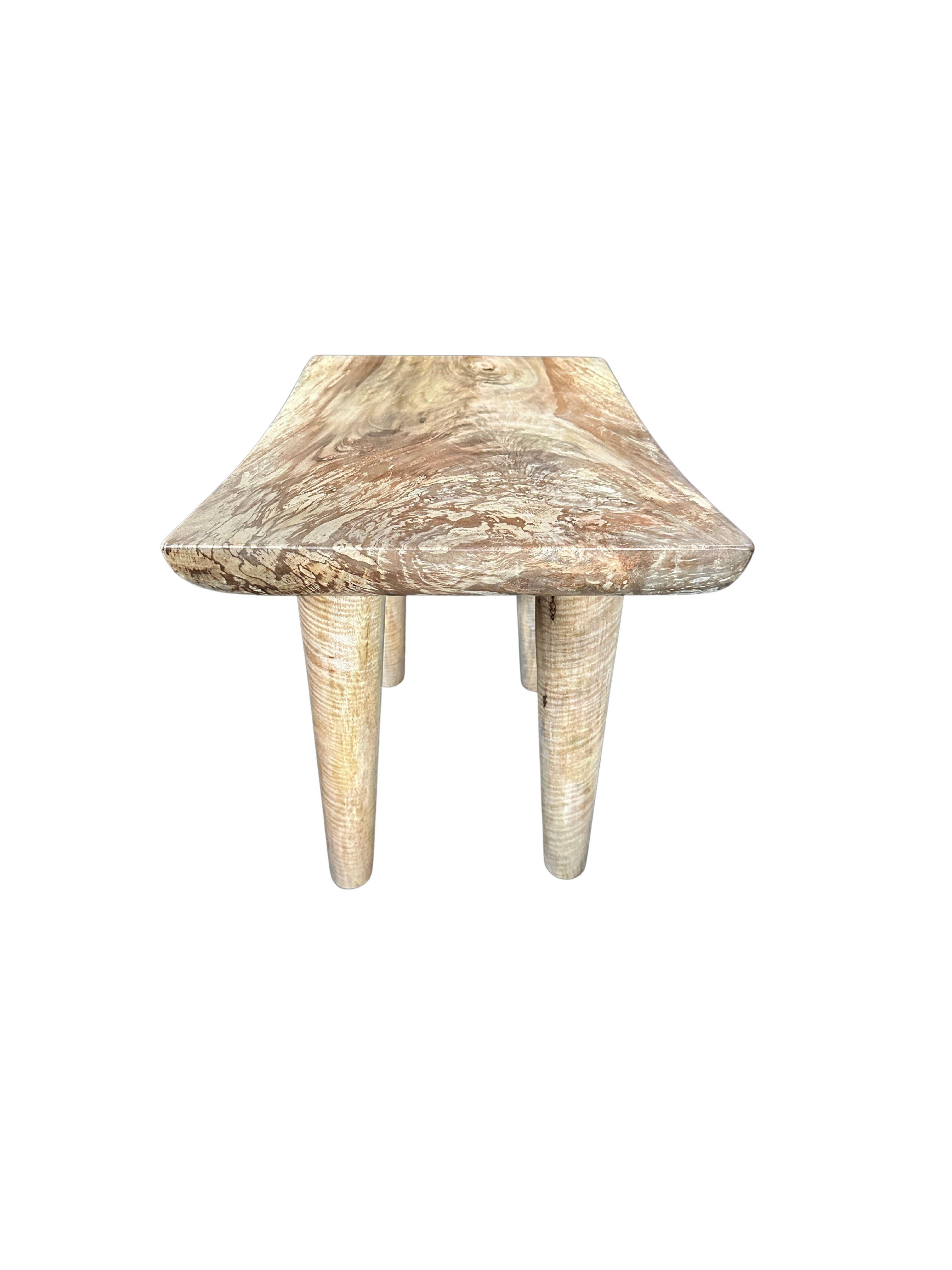 Indonesian Sculptural Mango Wood Stool with Curved Seat, Natural Finish For Sale