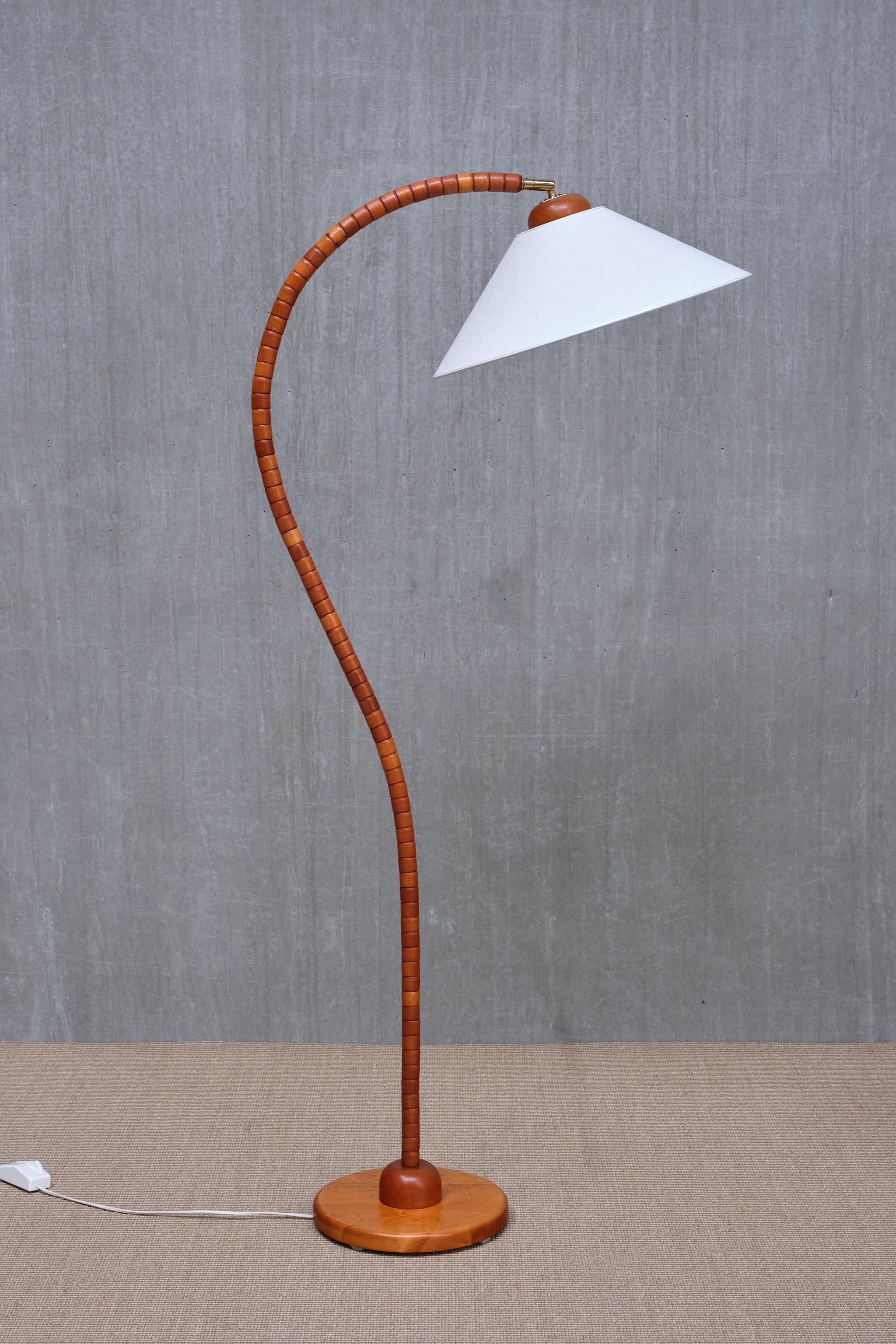 This striking floor lamp was produced by Markslöjd in Kinna, Sweden, in the 1960s. The piece is marked with the Markslöjd label and model number on the underside of the base.

The design is characterized by a sculptural, organically shaped frame
