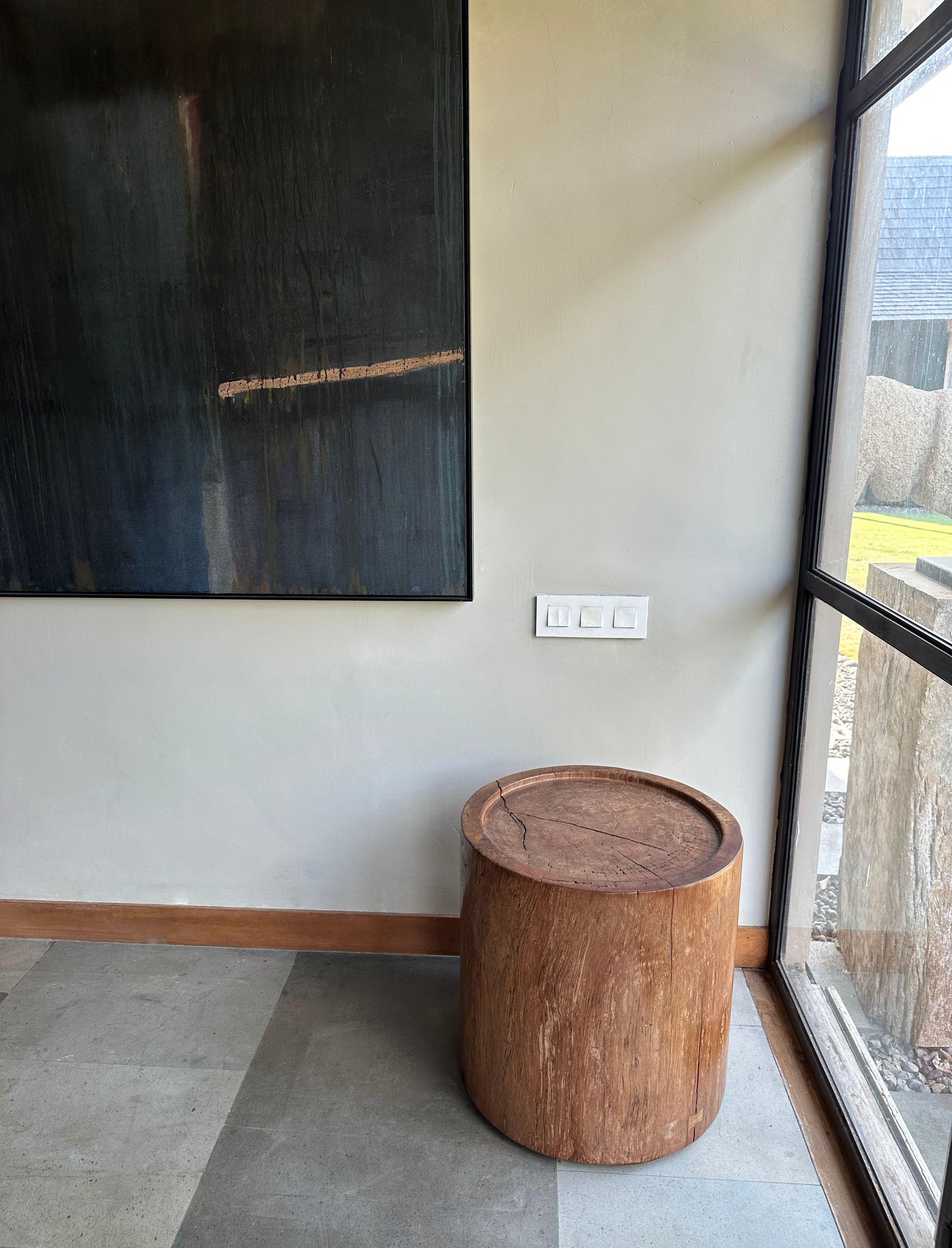 A wonderfully sculptural side table crafted from Maranti Wood. Maranti Wood is known for its strong and durable nature as well its unique wood textures and shades. The subtly carved basin on the table top with narrow border add to its charm. The