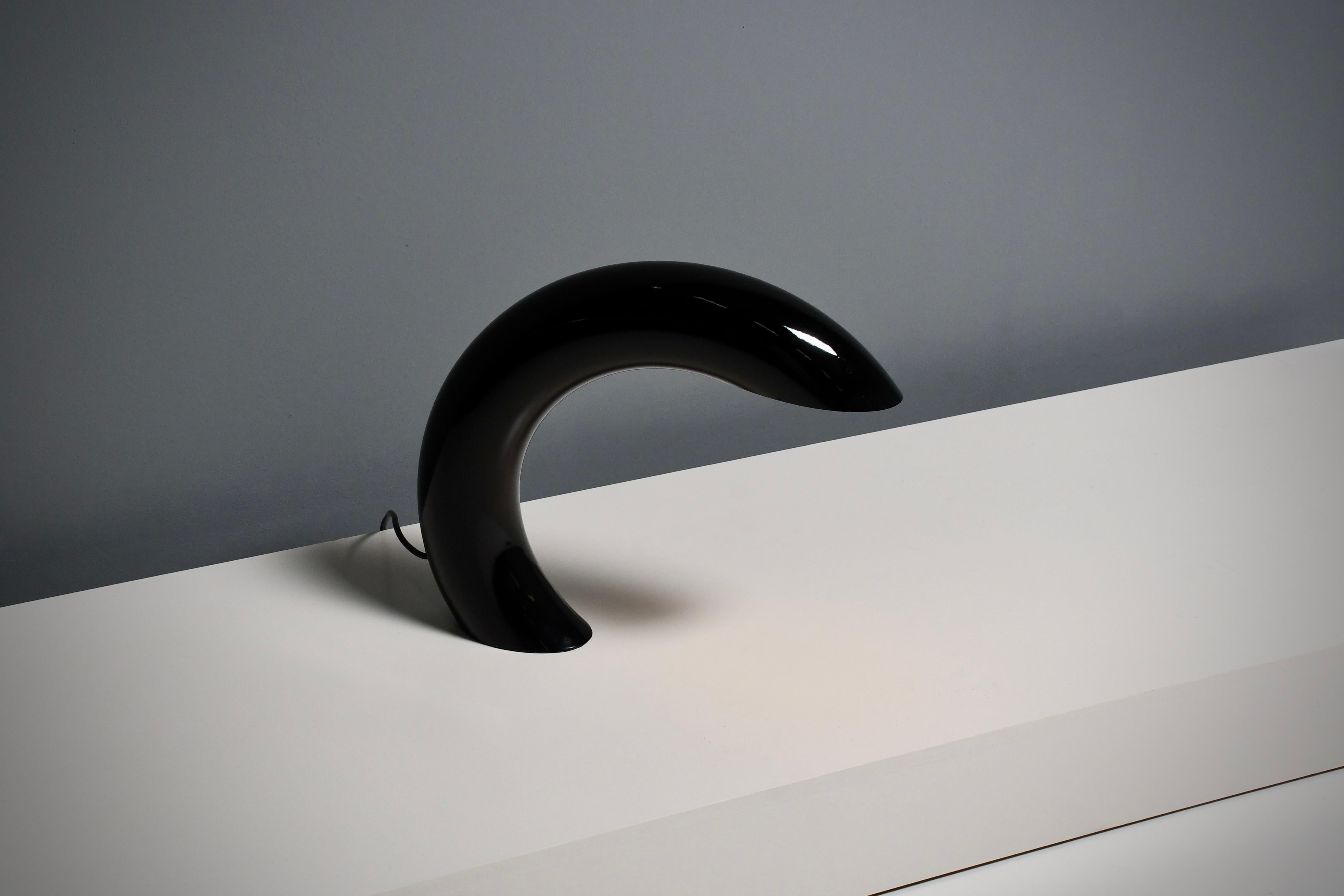 Sculptural shaped table lamp in very good condition.

Designed by Georges Frydman, France 1960s.

This lamp is a masterpiece of minimalistic elegance. 
Crafted from a solid circular tube of heavy cast aluminum, this sculptural table lamp stands as a