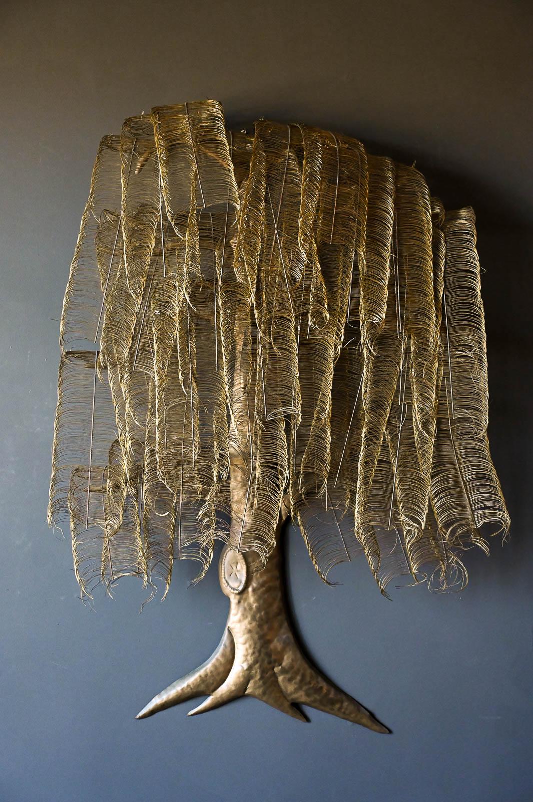 Sculptural metal willow tree by California Artist Jacqueline Huhem, 1970. Large hand made and signed wall hanging in the form of a willow tree. Each metal piece is hand intertwined and moveable. In the style of Curtis Jere. Signed with Jacqui of