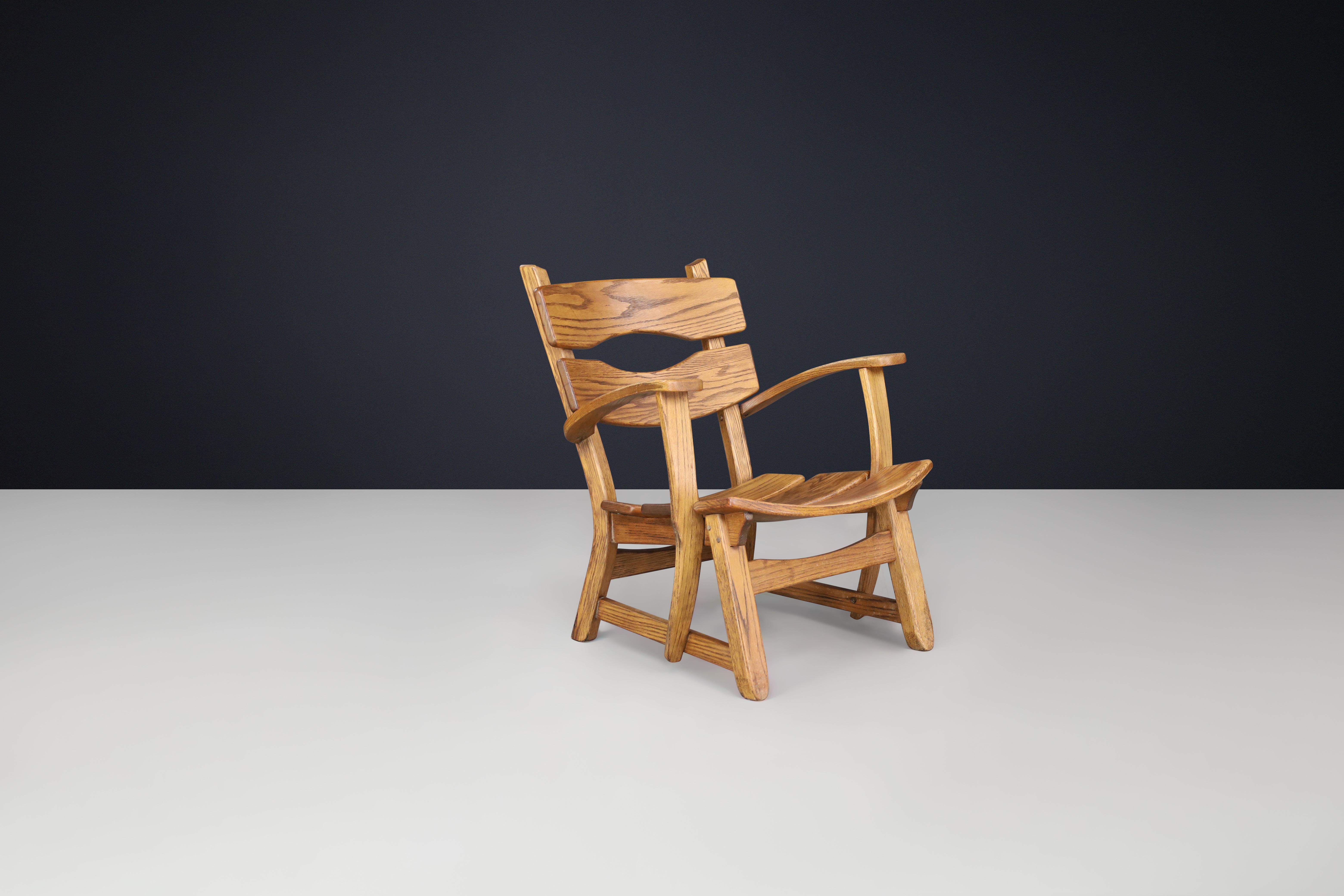 Mid-Century Modern Sculptural Mid-Century Armchair in Solid Oak, France, 1950s — 1 Available en vente