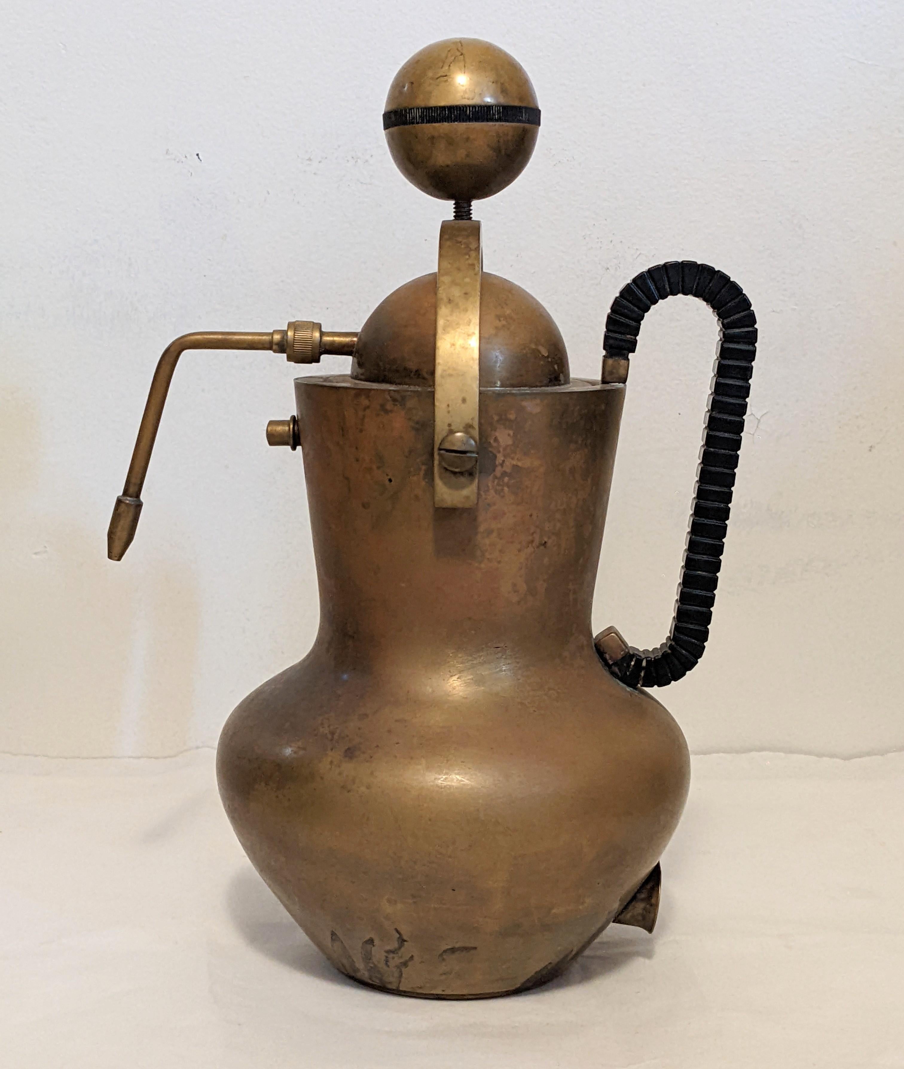 Sculptural mid-century Italian espresso maker from the 1940's. Incredible industrial design with fluted bakelite handle and accents. To open, unscrew the ball and it will swivel open as shown. Not intended for use, as it does have electrical