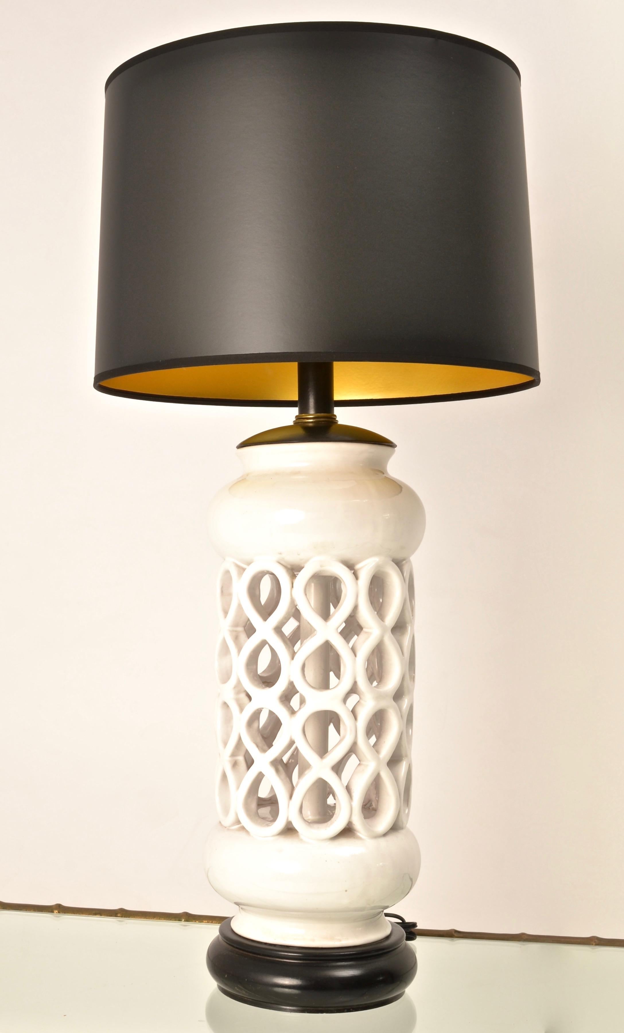 Very Palm Springs! Super glam. A sculptural Mid-Century Modern ceramic lamp, circa 1950s. Black and white chic with new wiring and a new black shade with gold liner. Lamp measures 10