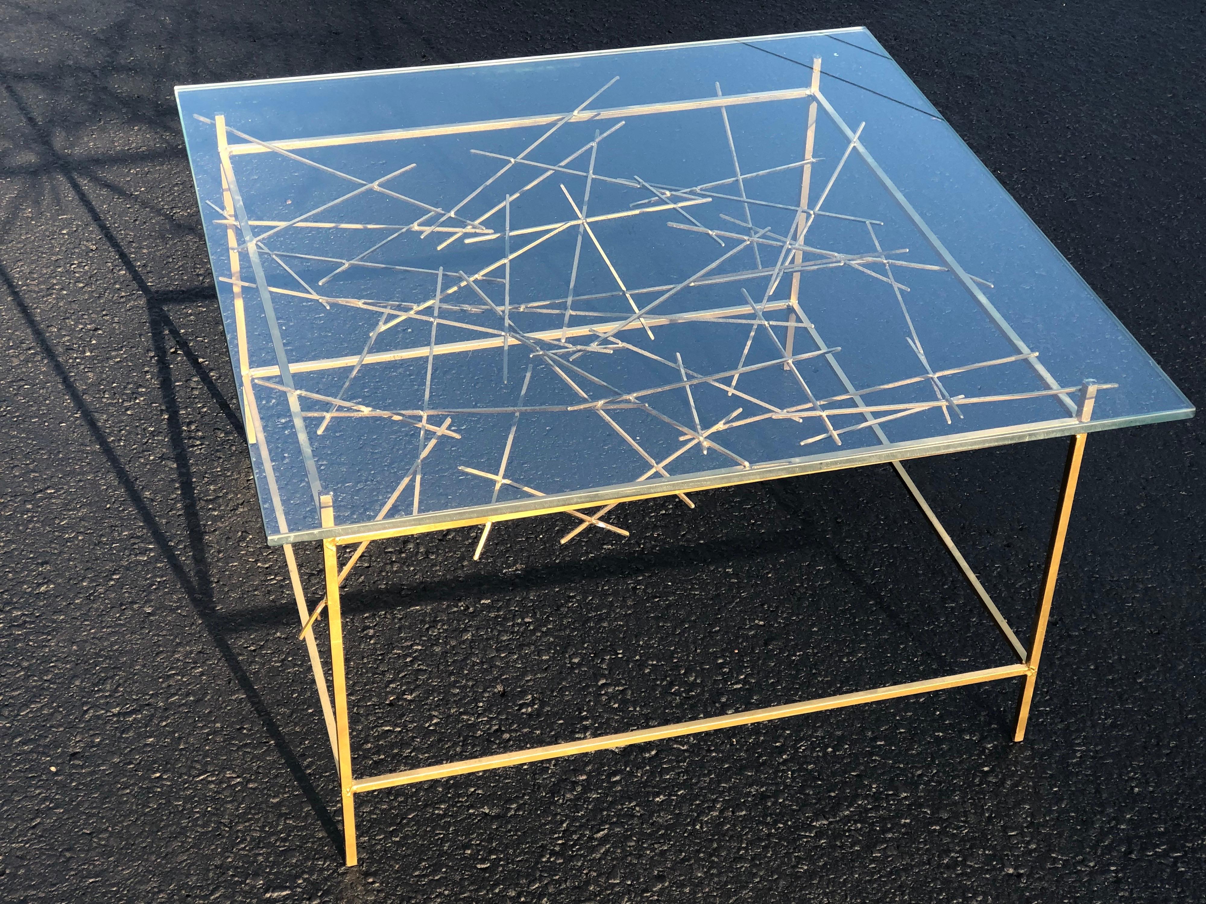 Sculptural Mid Century Modern coffee table. Amazing artisan piece that is mesmerizing. Hand soldered creation of rods and angles. A functional and stunning piece of art and furniture at the same time.