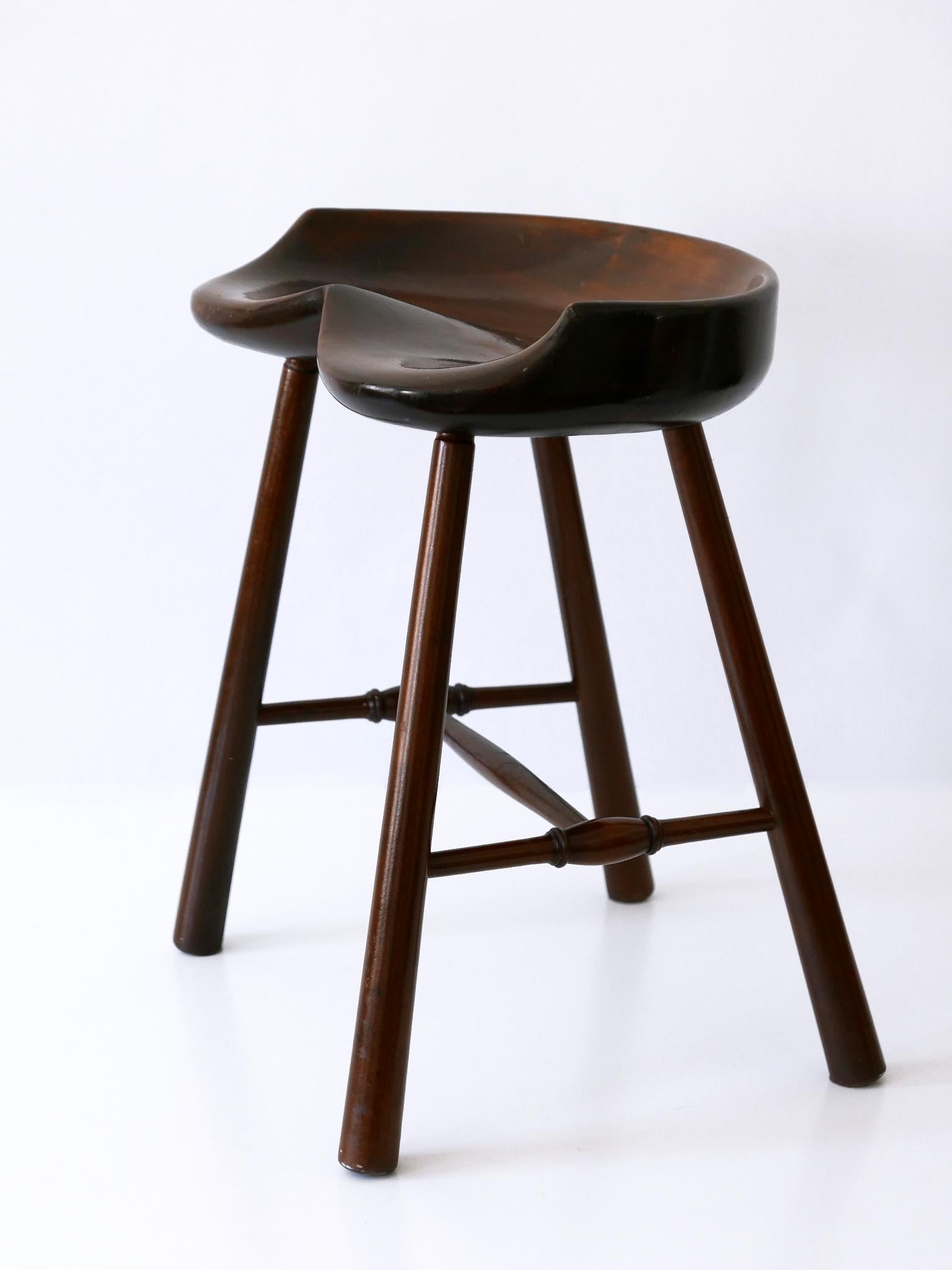 Extremely rare, beautiful and highly decorative Mid-Century Modern stool. Manufactured in Germany, 1950s.

Executed in solid wood.

Condition:
Good original vintage condition. Wear consistent with use and age.