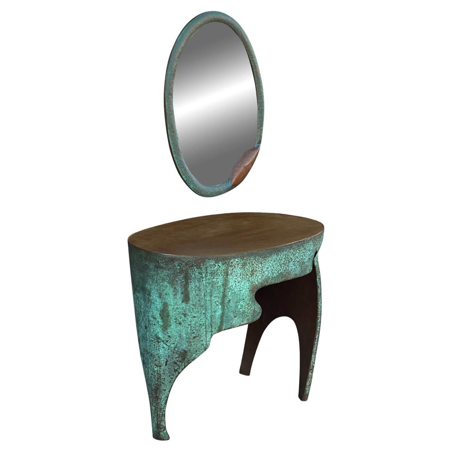A sculptural desk made of textured verdigris copper and smooth copper. Beautiful warm patina throughout. Comes with matching accessory oval mirror. Artist made circa 1960's and one of a kind.