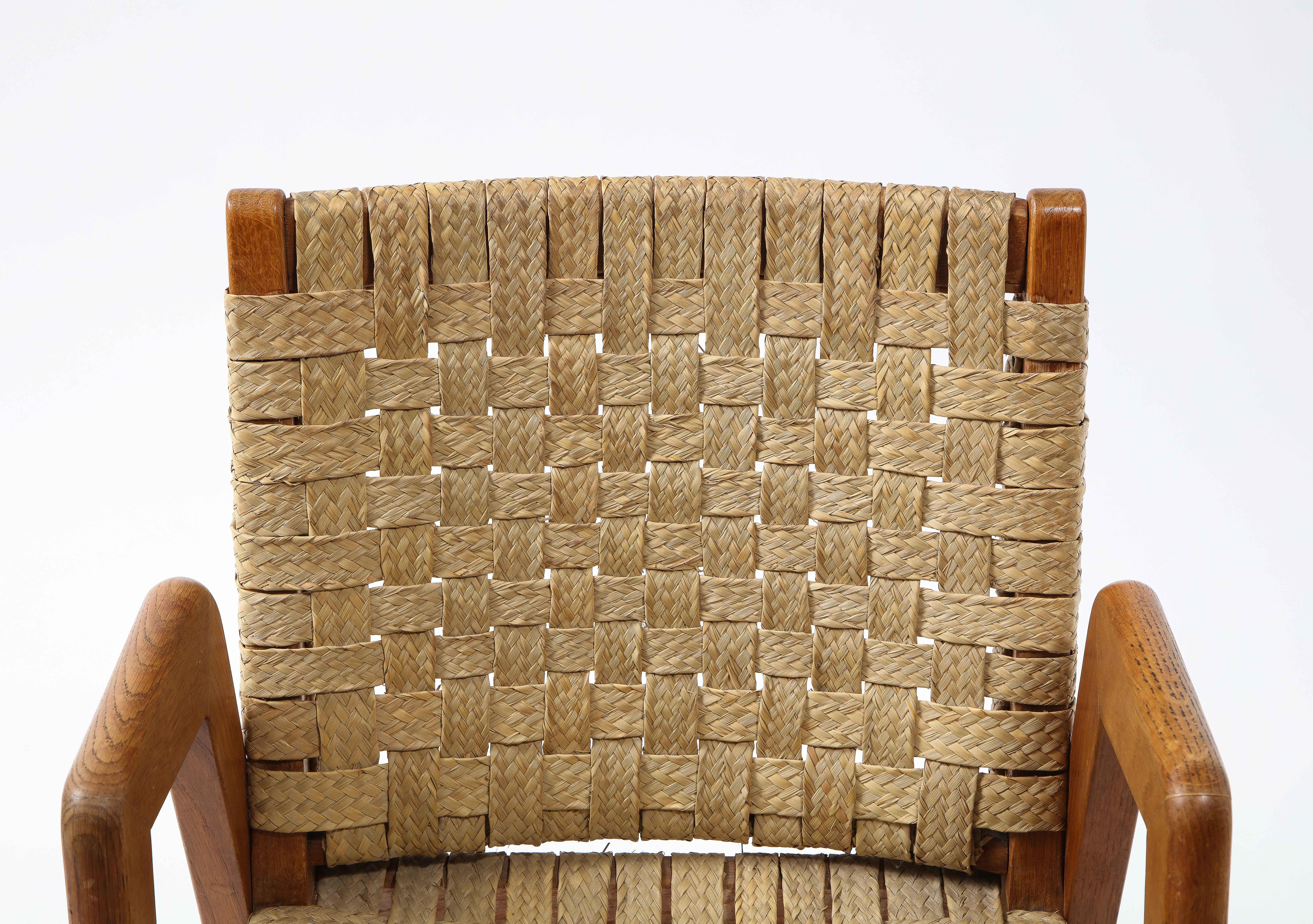 Sculptural Mid-century Rattan and teak side chair, France, 1960's.

Metal bolt fasteners are expressed on the sides. 

Rattan is in very good condition.

Sit is very upright, best used as an accent piece.