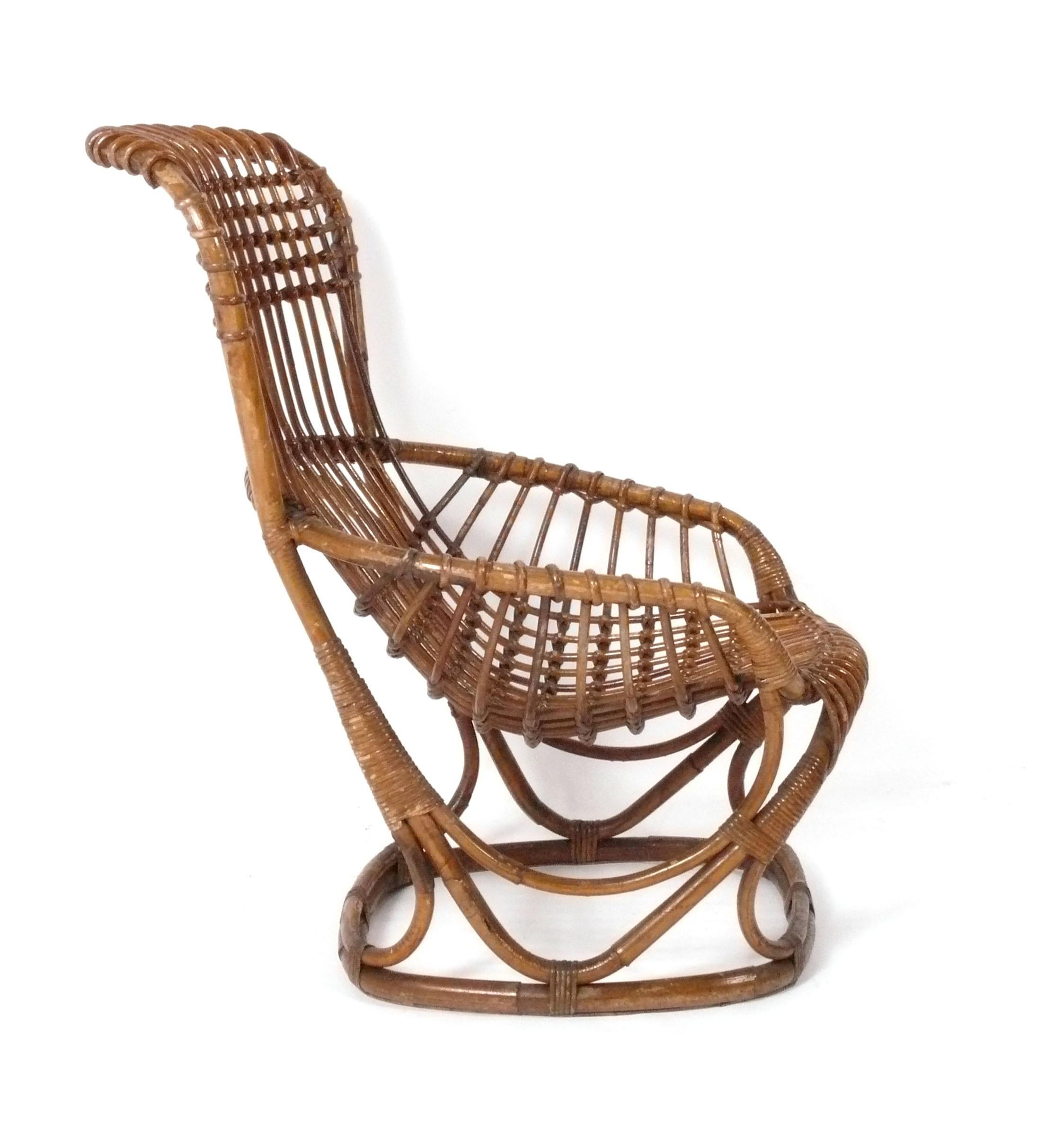 Curvaceous Mid Century Rattan Lounge Chair, in the style of Franco Albini, Italy, circa 1960s. 