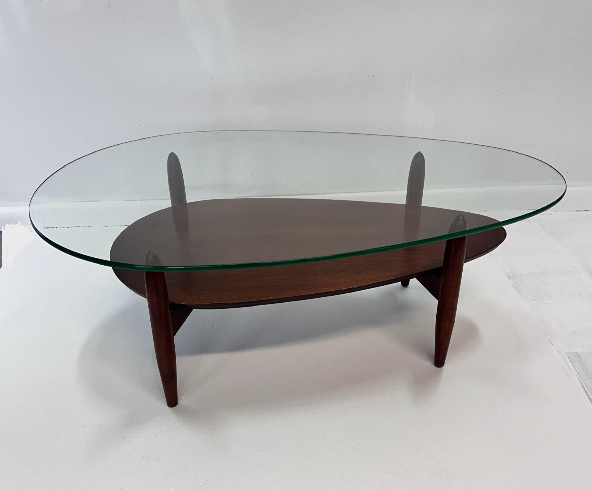 A rare and coveted design by Adrian Pearsall for Craft Associates, the R1917-TGT teardrop table. Found in walnut with what looks like the original glass top although not the planter glass, this glass top has age and looks to be the same manufacture