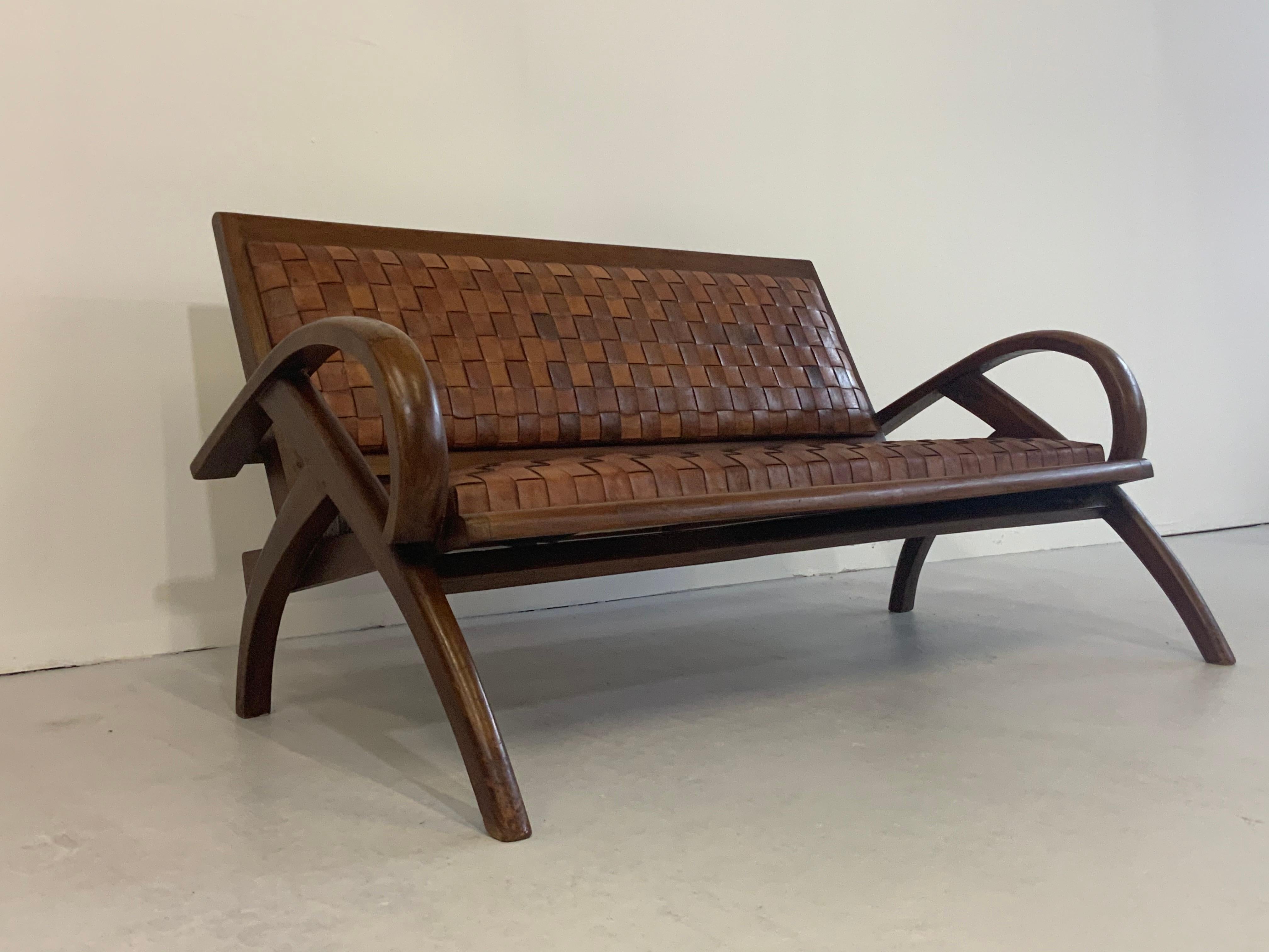 This captivatingly beautiful & very rare bench, settee ( 2-seat ) is a classical Scandinavian/ Danish Modern design beauty from 1950s-1960s. 

Special features are the thick webbed - marvellous patinated - leather stripes in cognac brown and the