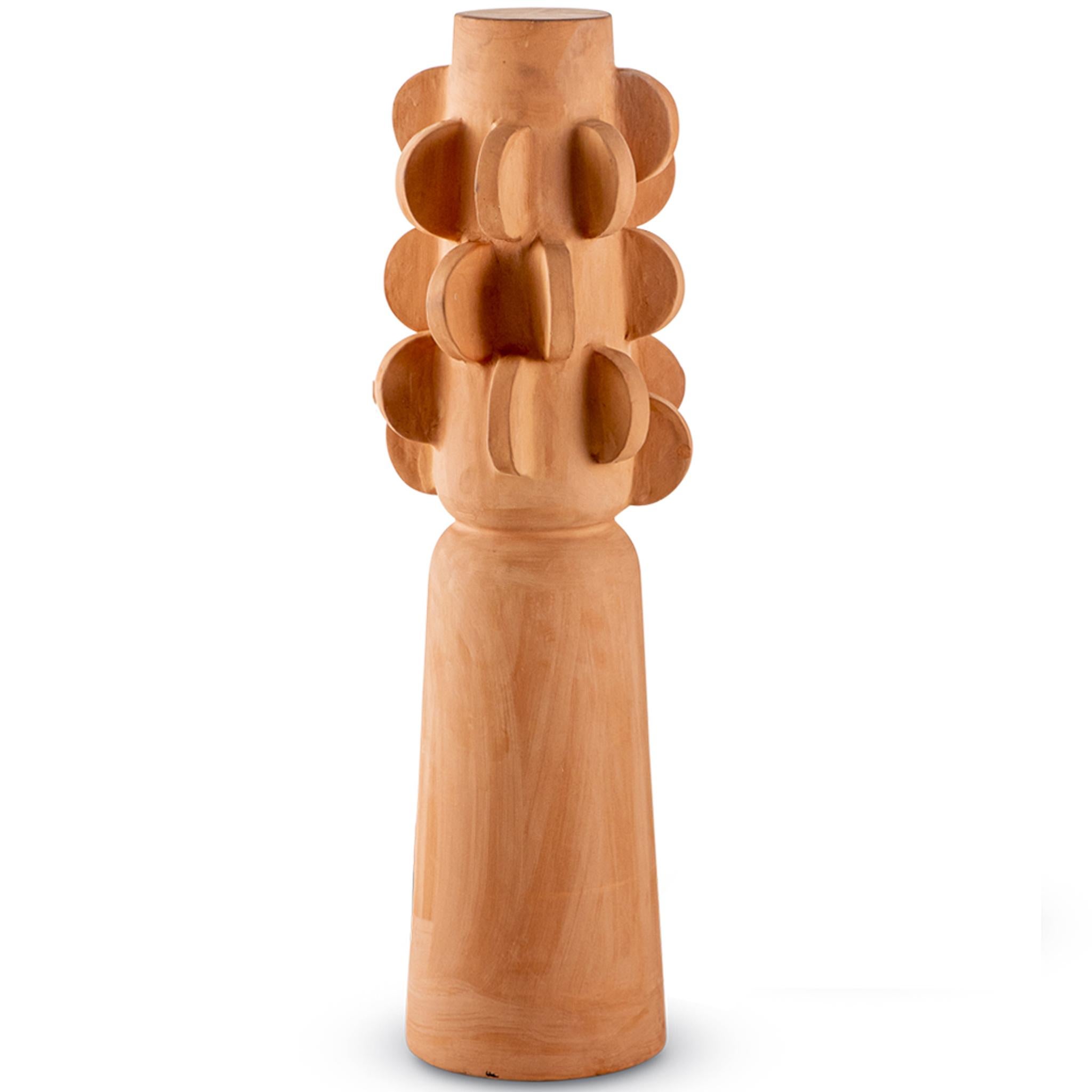 This modern sculptural Brutalist decorative totem by Egg Designs merges sculptural form with primitive inspiration. Handcrafted in unglazed terracotta, the design draws on tribal motifs, showcasing bold geometric reliefs and intricate surface