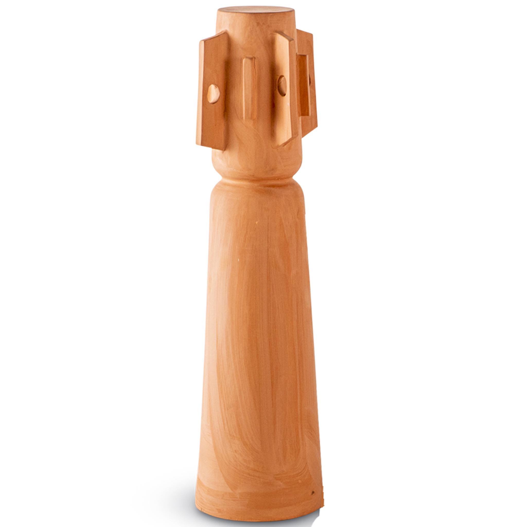 This modern sculptural Brutalist decorative totem by Egg Designs merges sculptural form with primitive inspiration. Handcrafted in unglazed terracotta, the design draws on tribal motifs, showcasing bold geometric reliefs and intricate surface