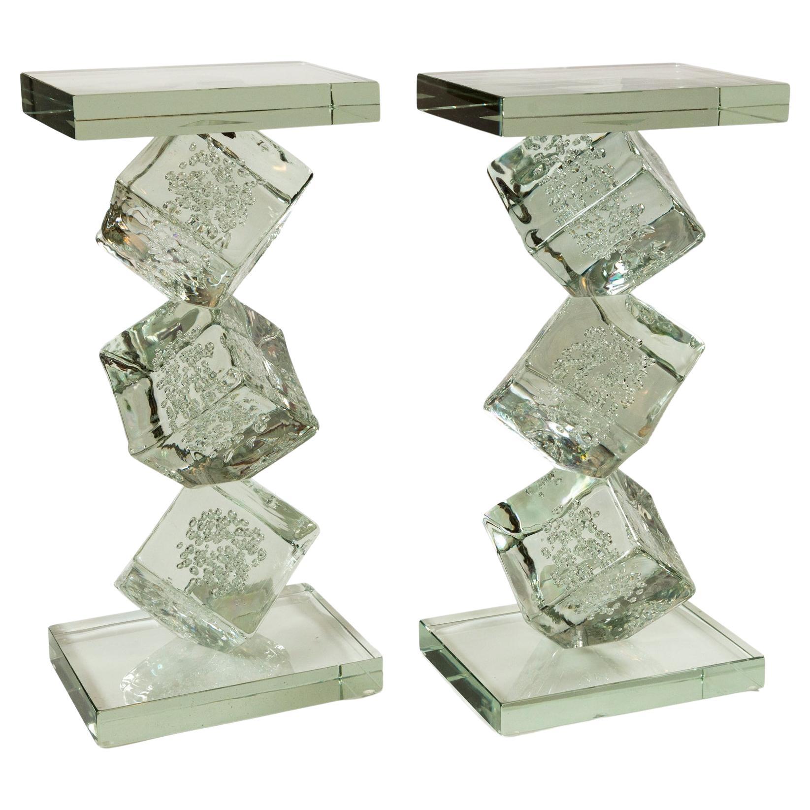 Whimsical and beautifuly executed end table composed of 3 large blown clear cube-shaped glass sculptures with floating bubbles which are then  irregulary  stacked upon one another and finished with a 1.6 inch thick rectangular-shaped clear glass