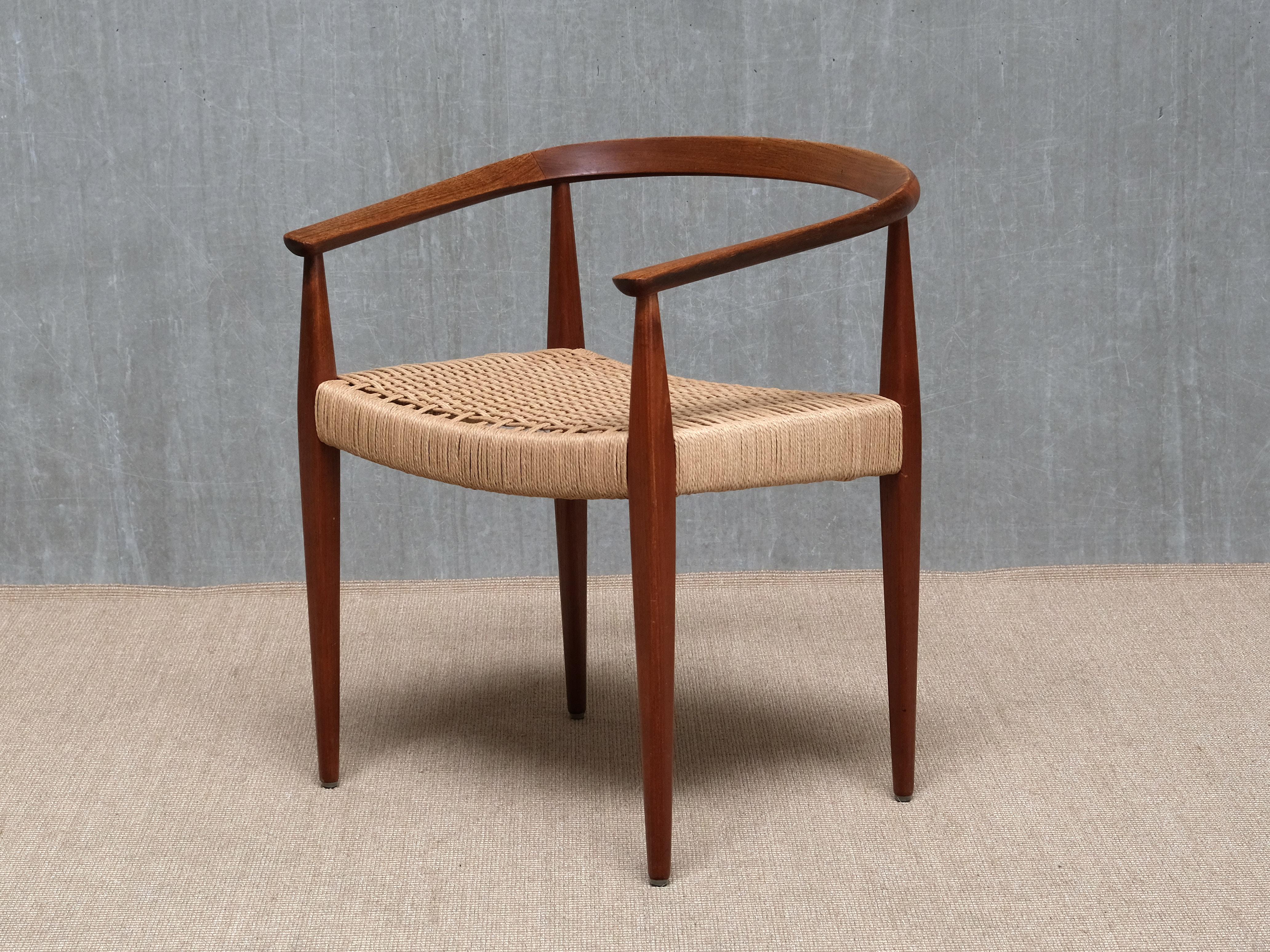 This very rare armchair was designed by Nanna Ditzel and produced by Povl Kolds Savværk in the mid-1950s. 
The Model 113 is an important example of Danish Mid-Century Modern design, defined by its circular, gently curved backrest and balanced,