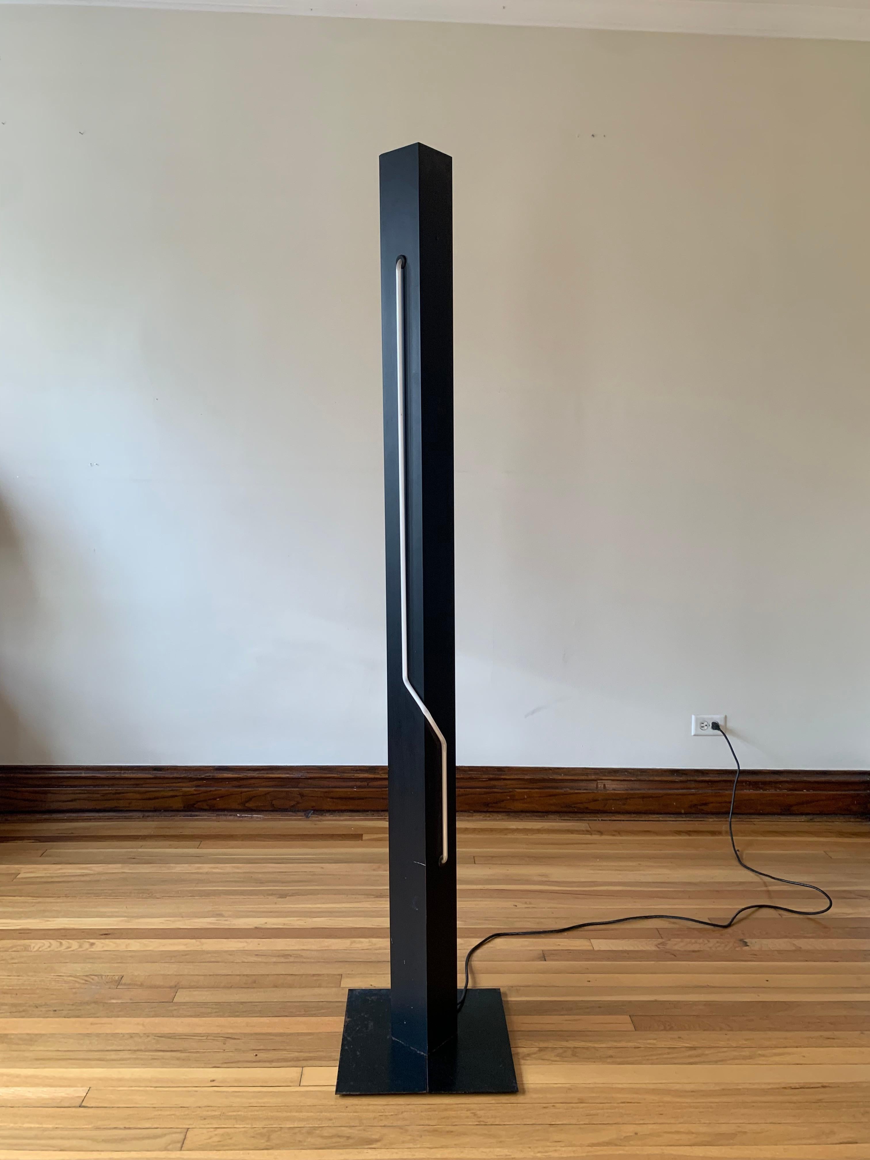A true statement. Sculptural, monolithic torchiere with a magenta neon element designed by Dan Chelsea of Let There Be Neon, founded by Rudi Stern, in collaboration with George Kovacs. A total must have for any fan of the eclectic and post-modern,