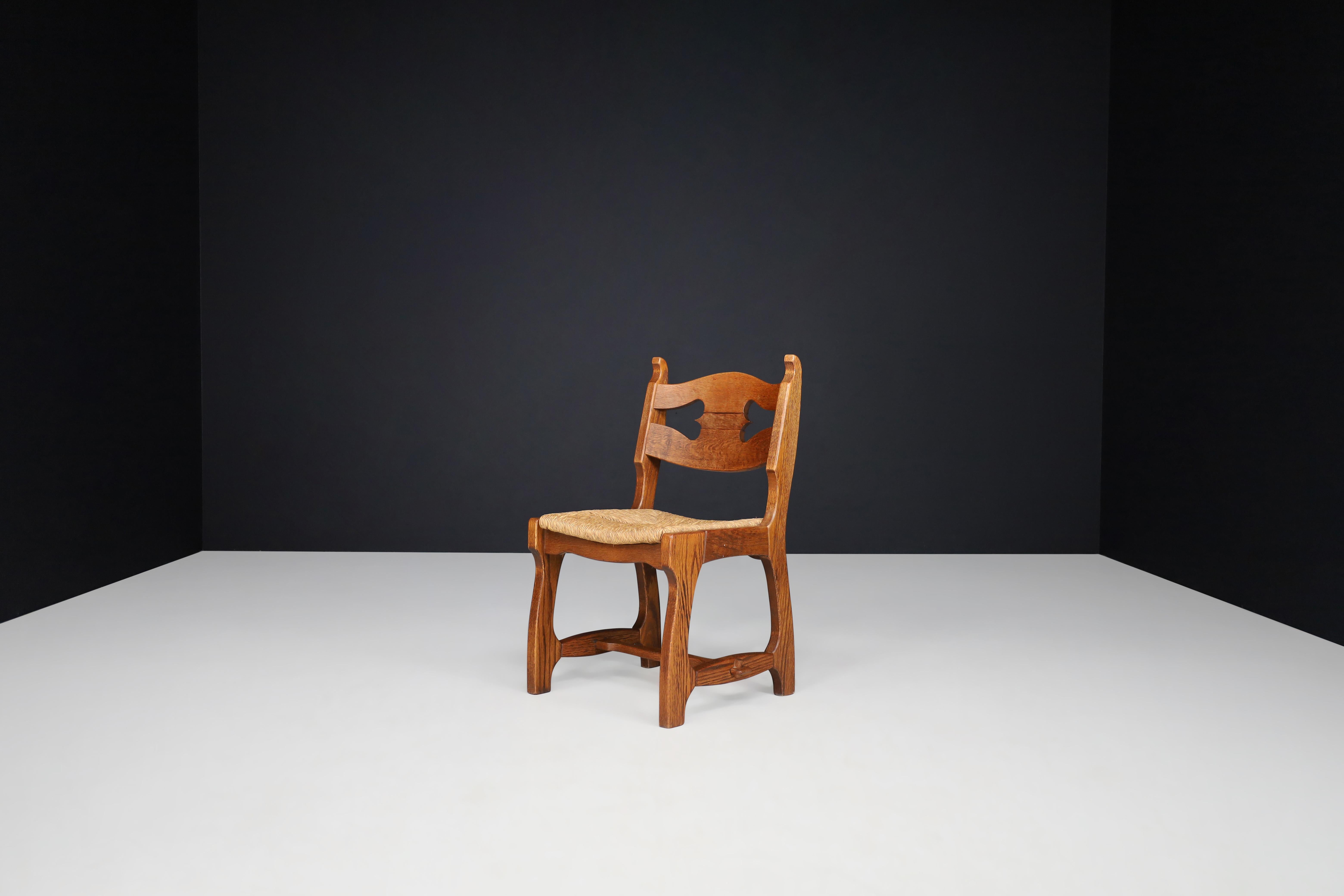 European Sculptural Oak and Rush Dining Chairs, France, 1960s For Sale