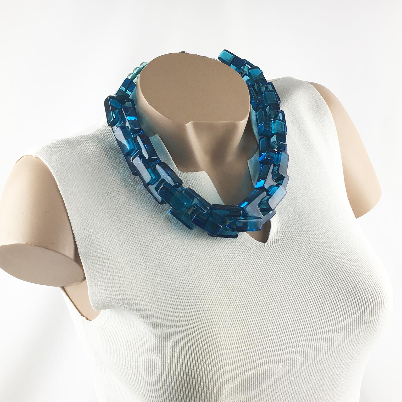 Beautiful sculptural Lucite choker necklace. Transparent ocean blue color in a heavy and bold carved massive chain links. Fits nicely around the neck. From an Italian design studio, no visible maker's mark. 
Measurements: Necklace total length is