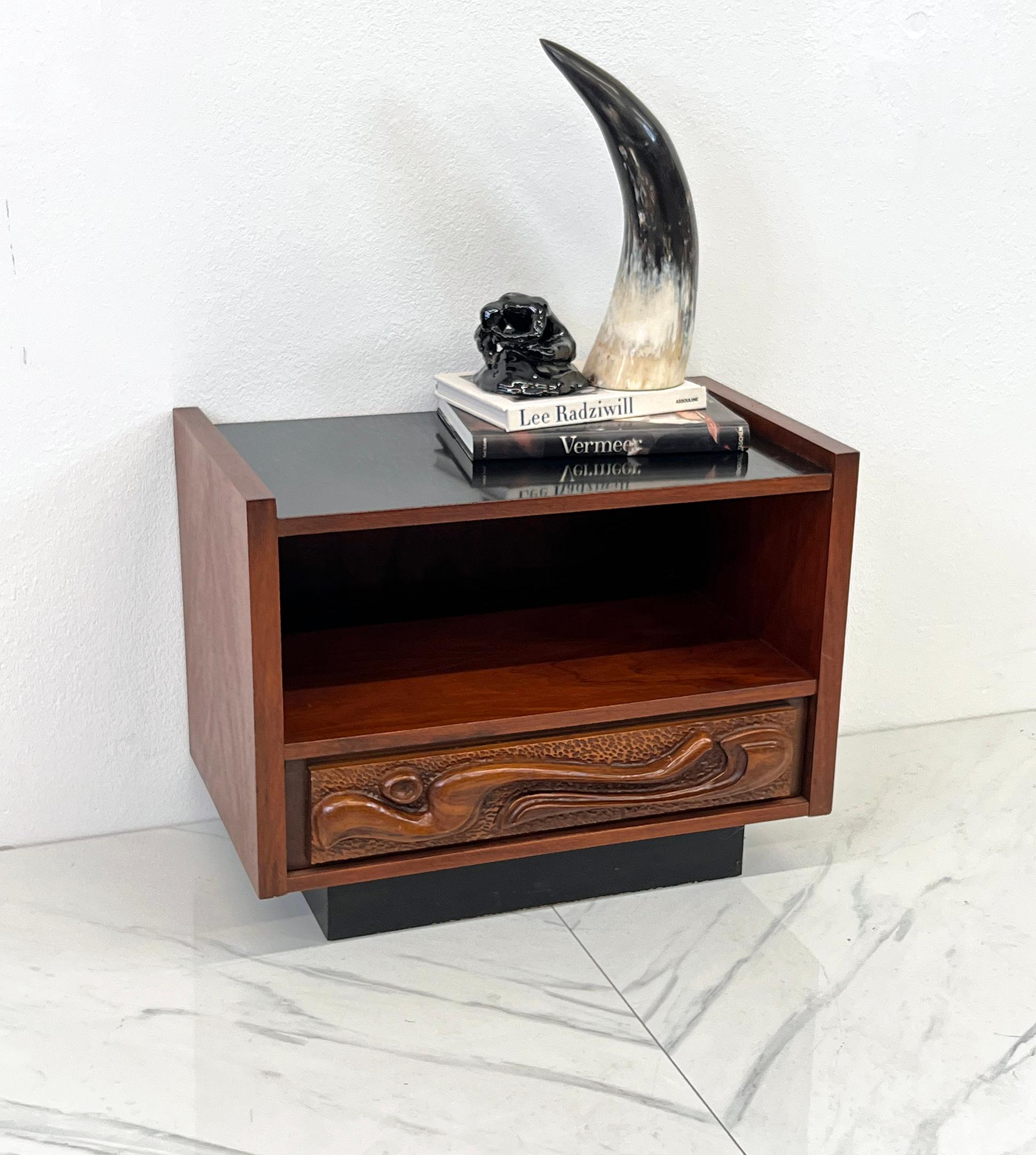 Transport yourself to the golden age of tiki chic with this fabulous nightstand by Pulaski, designed in the unmistakable style of Witco from the 1960s. This was the iconic Pulaski Oceanic line. Imagine a piece that’s as much art as it is furniture,