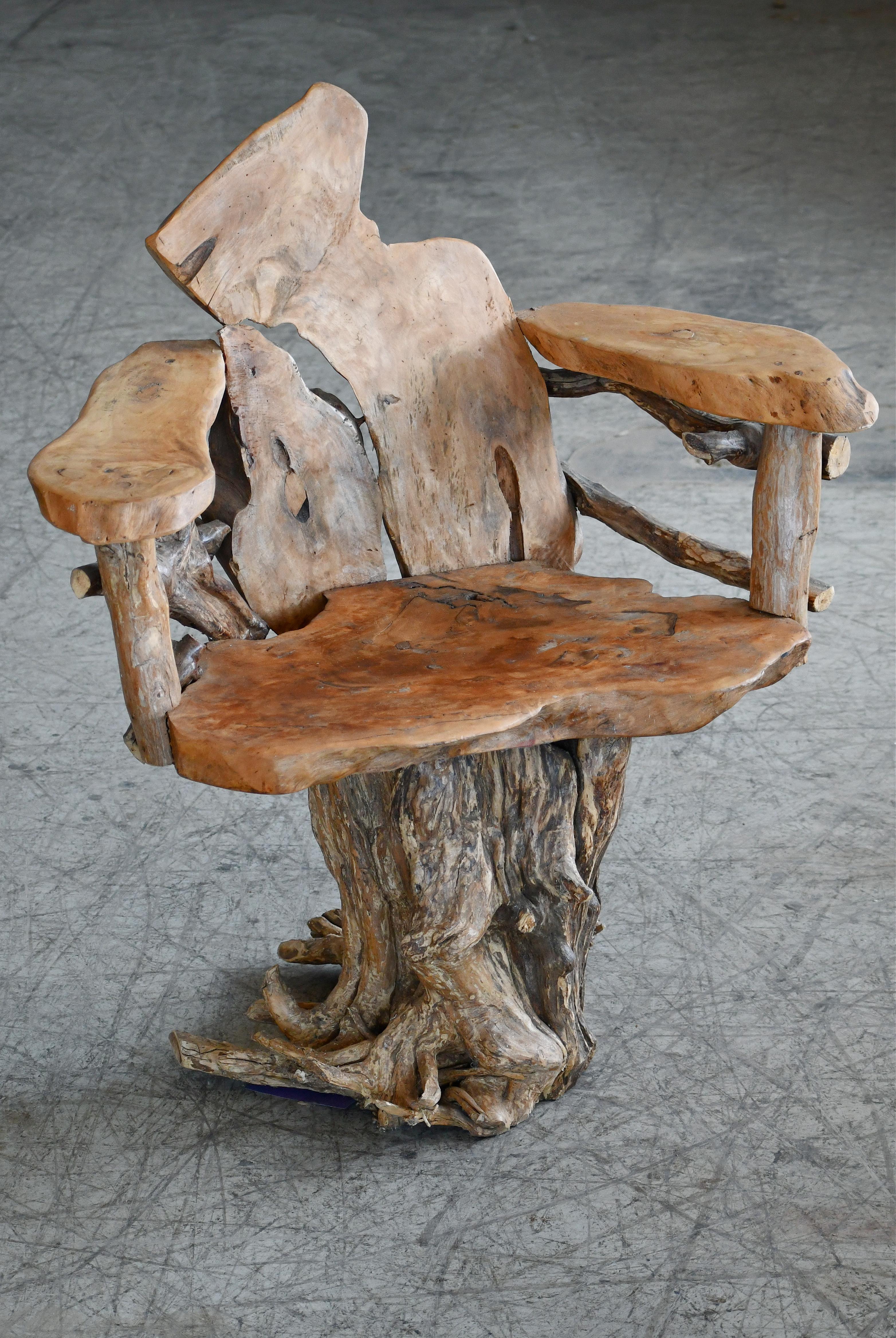 A sculptural, organically shaped chair made from Teak root in the style of Daryl Stokes.  We are uncertain of the maker and period but we found the chair in Denmark. Sturdy and strong construction. Great color and grain and overall very good