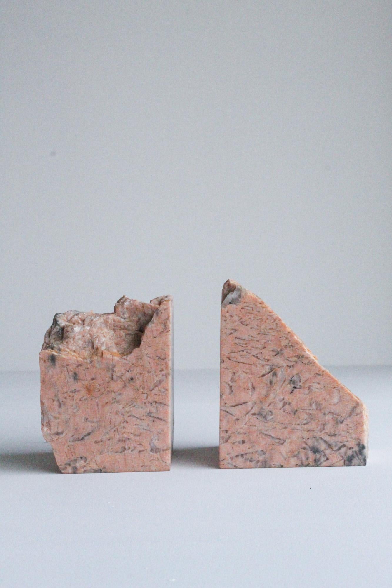 A pair of stunning organic modern bookends crafted out of pink natural marble featuring a beautiful design making them a perfect addition to a home or office space. Ettore Sottsass and Gaetano Pesce Books in photos are not included and are just for