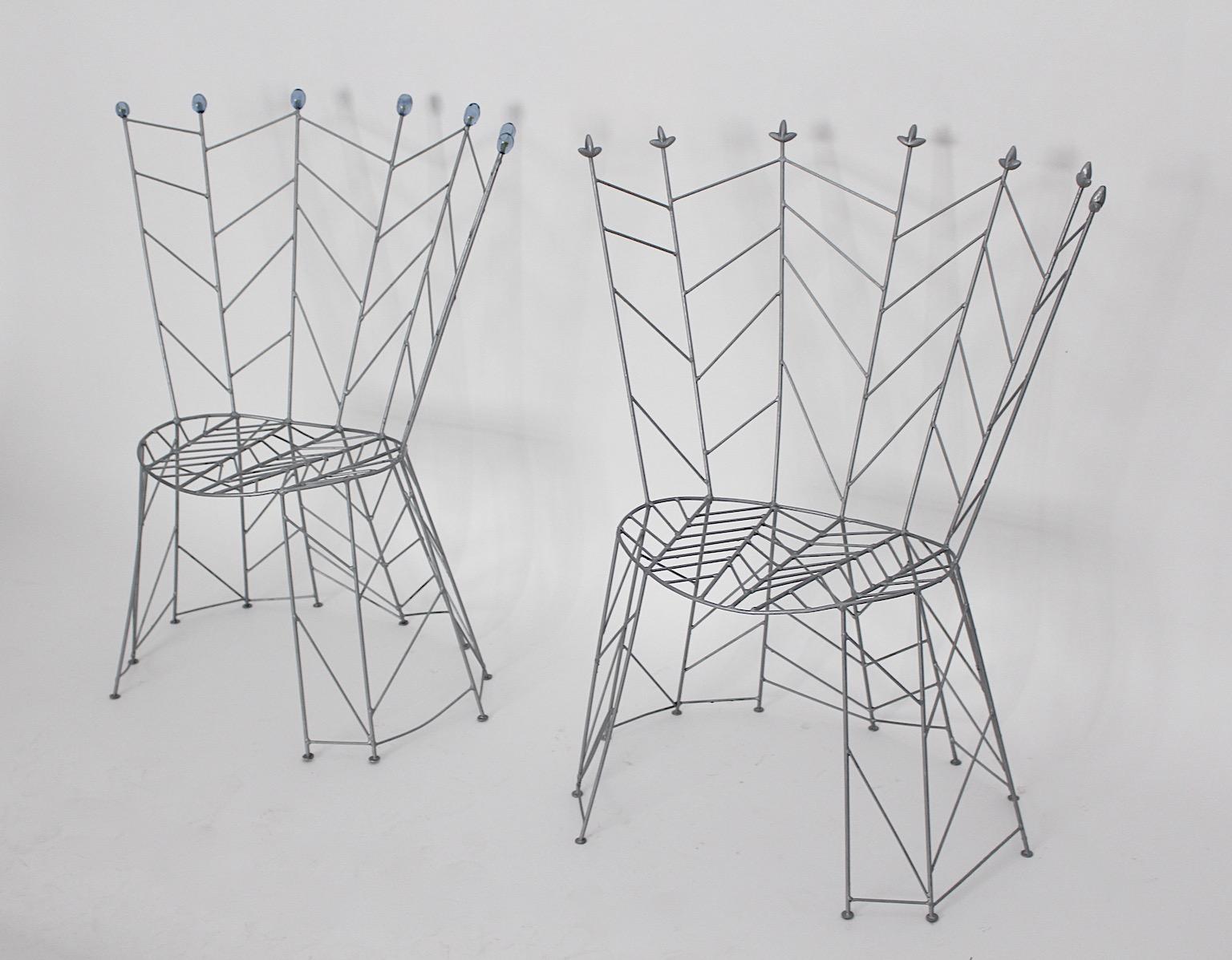 Sculptural metal vintage chairs model Pupeny or Buds by Bohuslav Horak, 1988. 
A sculptural and fairy-tale design with a twist, these side chairs show this combination. This model named Pupeny (Buds) designed by Bohuslav Horak, born 1954 looks like