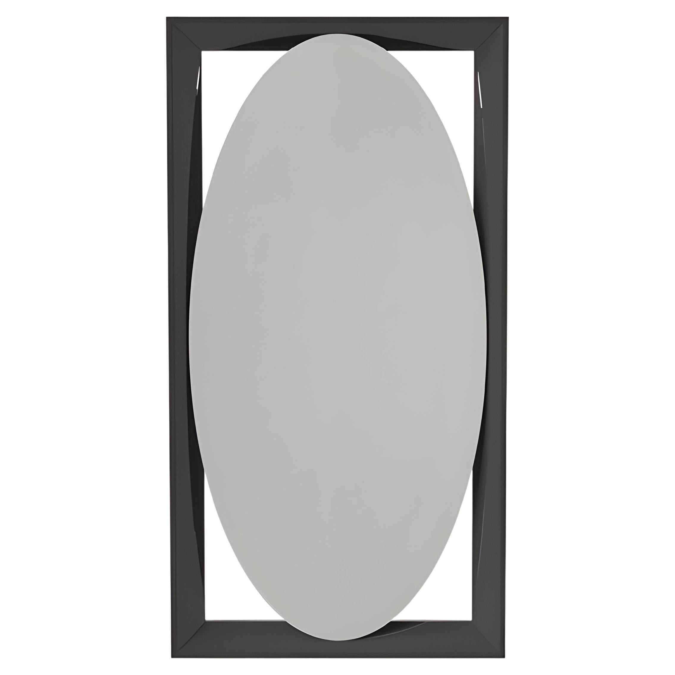 This contemporary sculptural mirror by Mondo Design explores the dialogue between geometry, materiality, and reflection. The piece features an elongated oval mirror suspended within a rectangular frame crafted from solid wood. The warm, natural wood