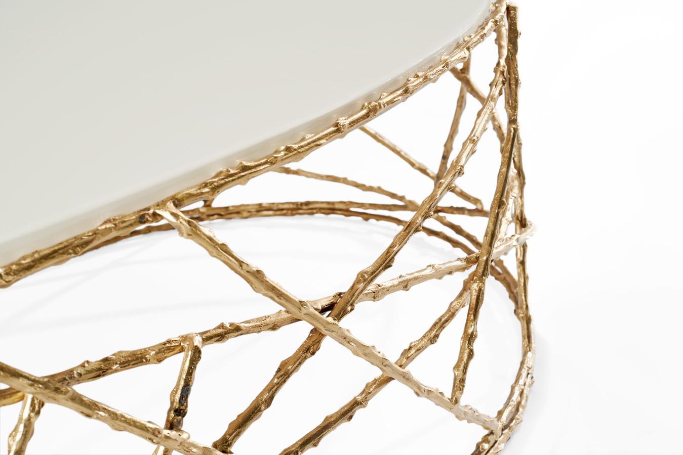 Timeless rosebush branches, skillfully cast in brass, impart a sense of permanence to this refined table. Artisans meticulously hand-assemble the base, while the table's minimalist top provides a calming and harmonious counterpoint to the